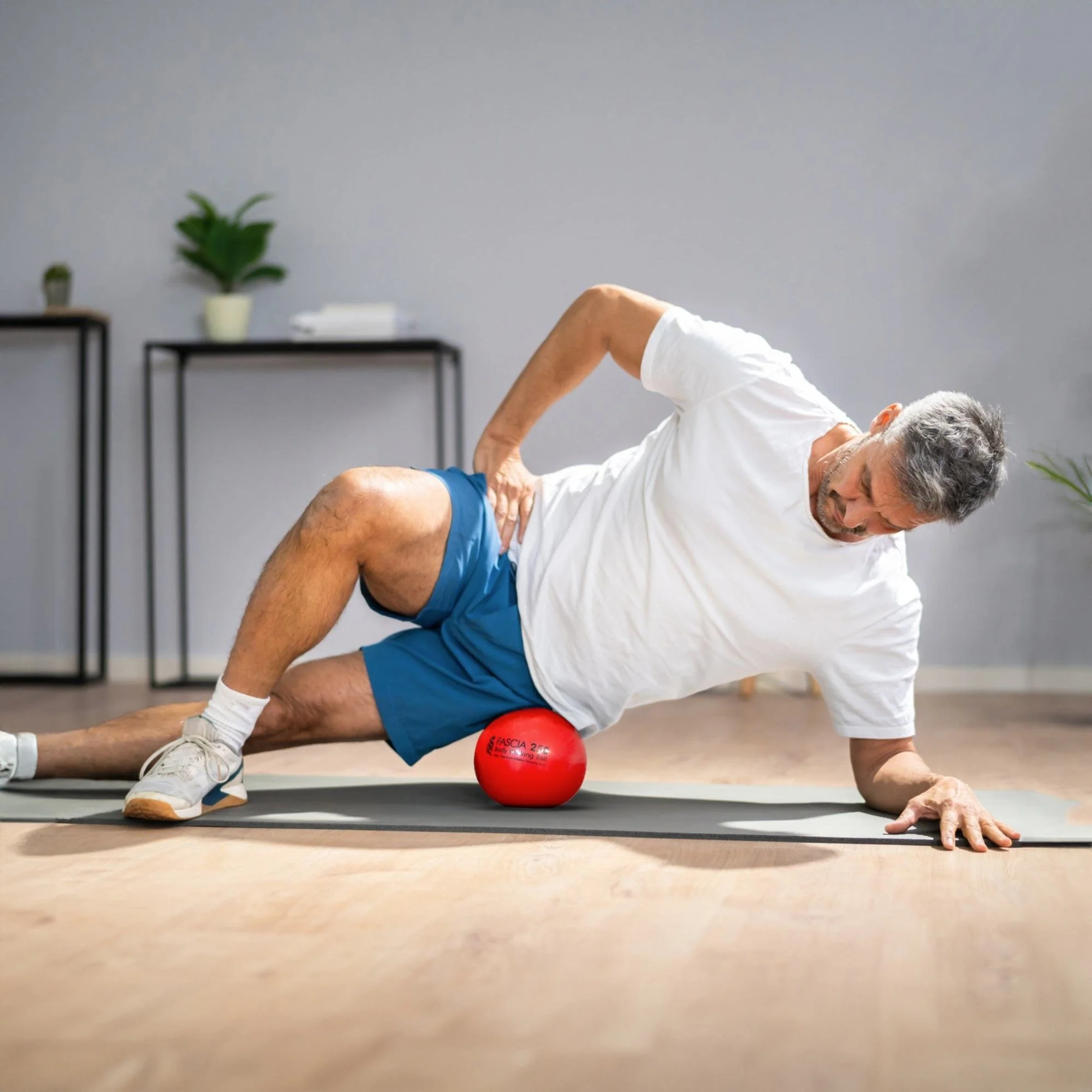 Man on body working ball Myofascial release