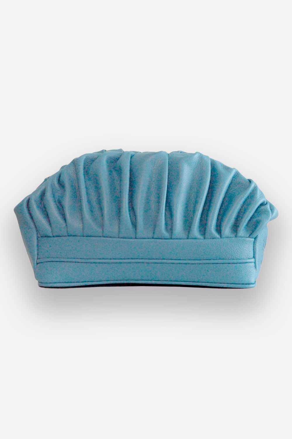 A light blue, textured, semi-circular sofa with a ridged backrest, against a plain white background.