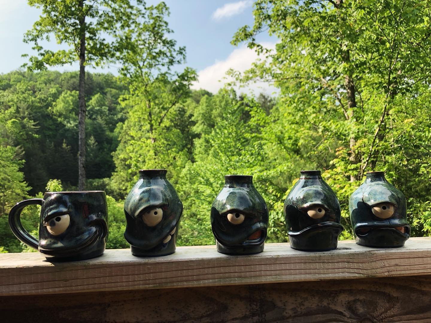 Got a set of small bottle vase (and a mug) faces covered in floating blue. 

Trying new glazing techniques with the faces so I&rsquo;m. It just underglazing and clear glazing. I had varying success on these, but collectively, they are pretty cool!

2