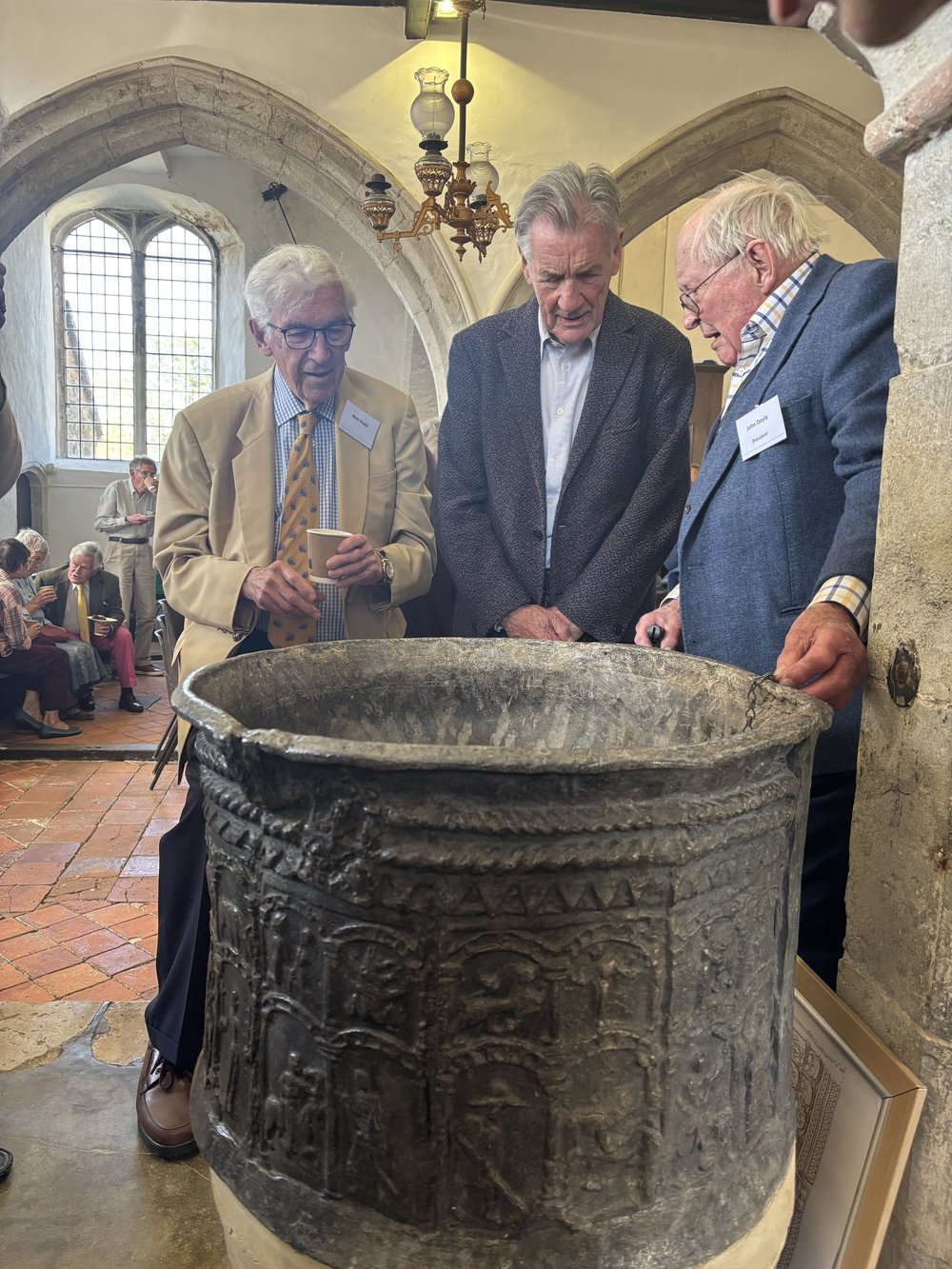 RMHCT's Nick Hudd and John Doyle with Sir Michael