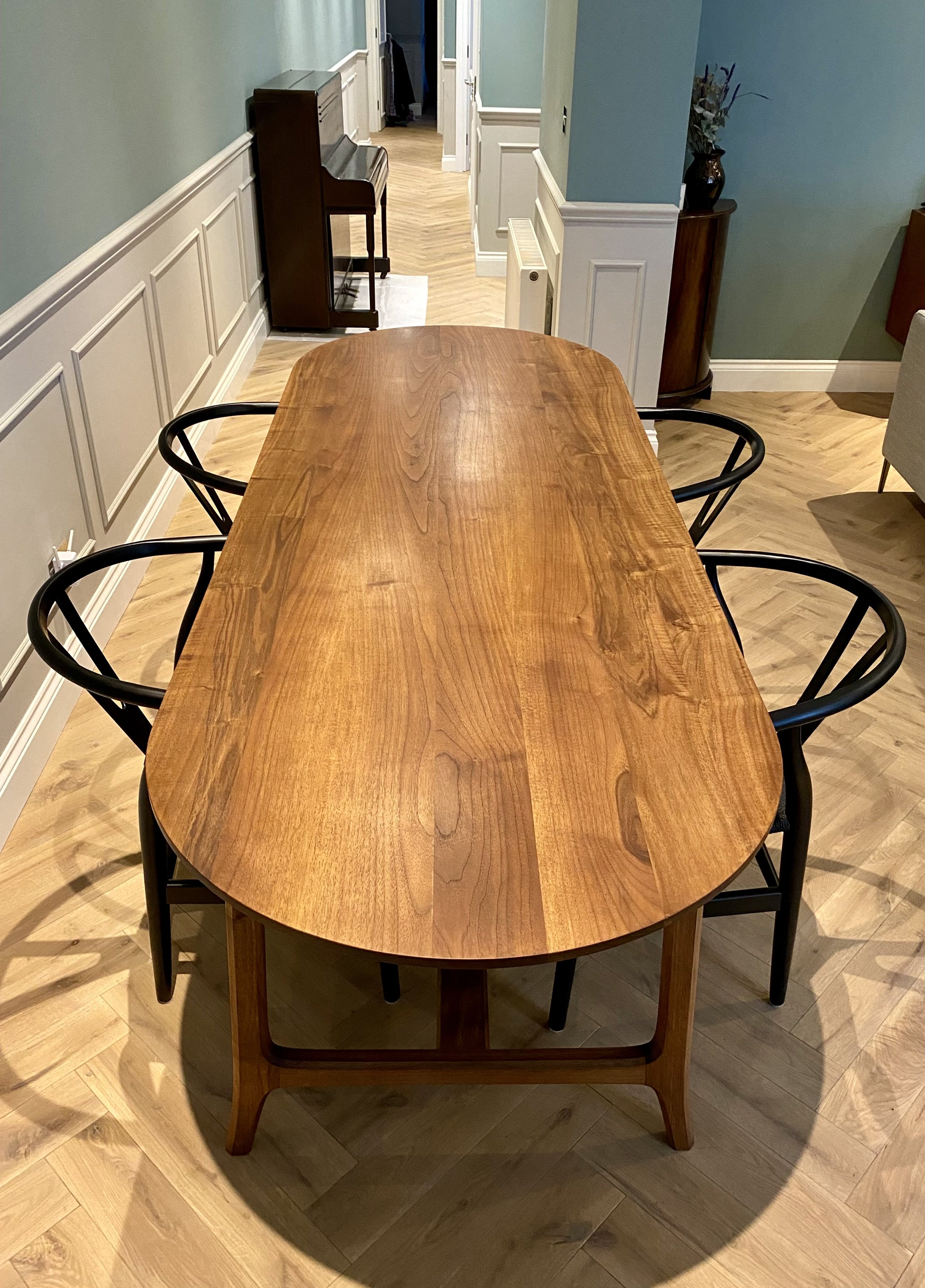 English walnut 8-seater dining table with mid-century inspired frame