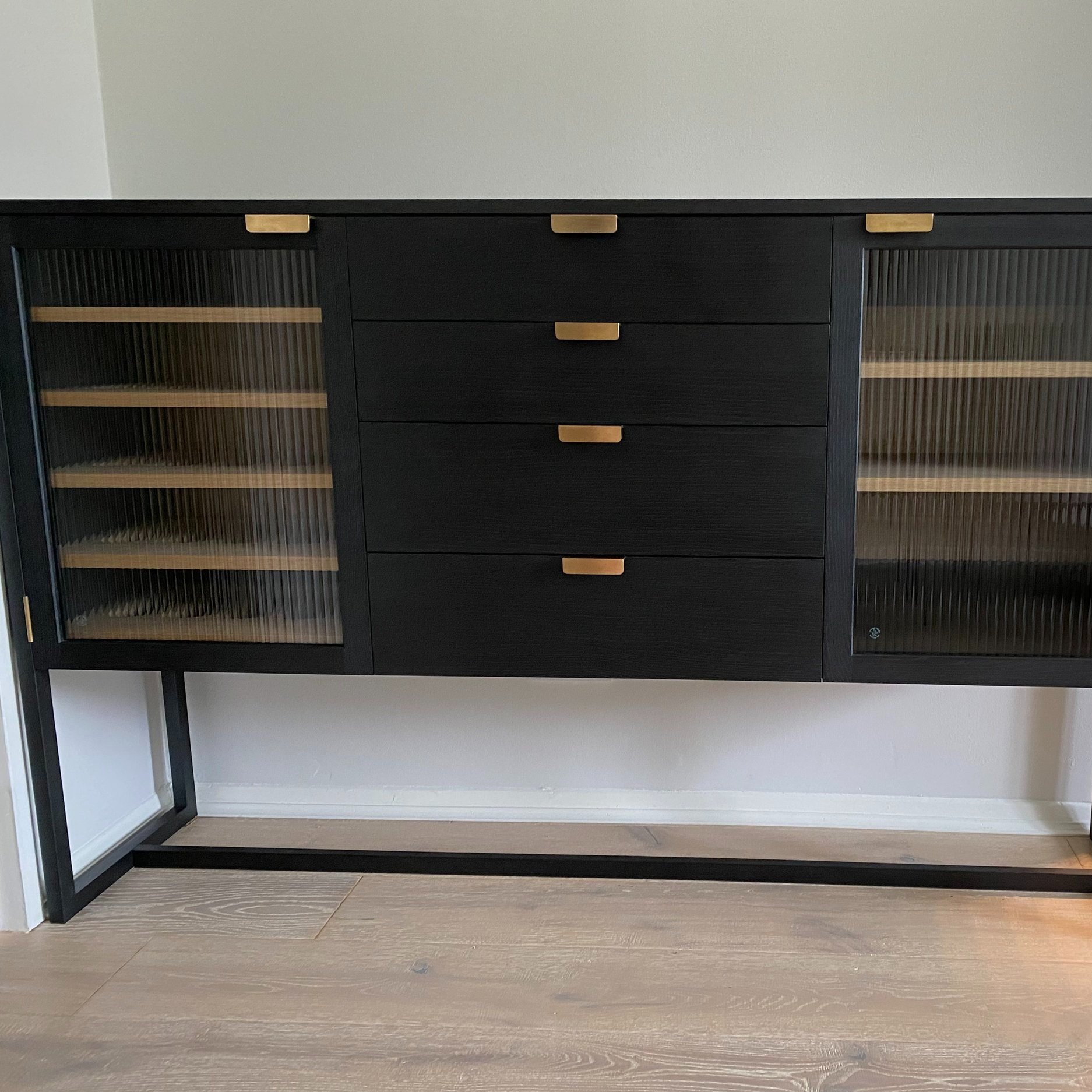 Sideboard in ebonised and natural English oak with bespoke brass hardware