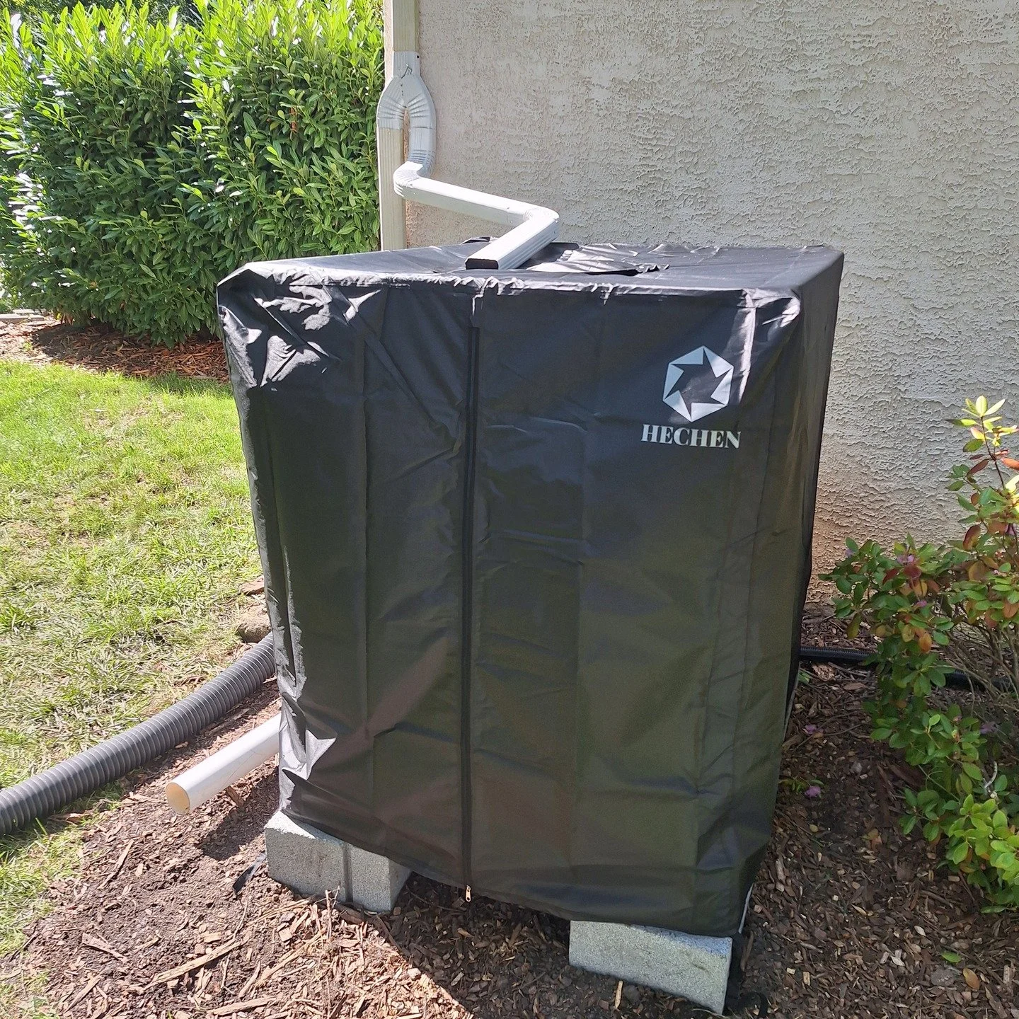 What's this black cube you ask? It's a rainwater harvesting system capable of storing approximately 275 gallons of rainwater!

We took a repurposed IBC tote, set it on a base of cinder blocks, made the necessary downspout modifications to enable wate