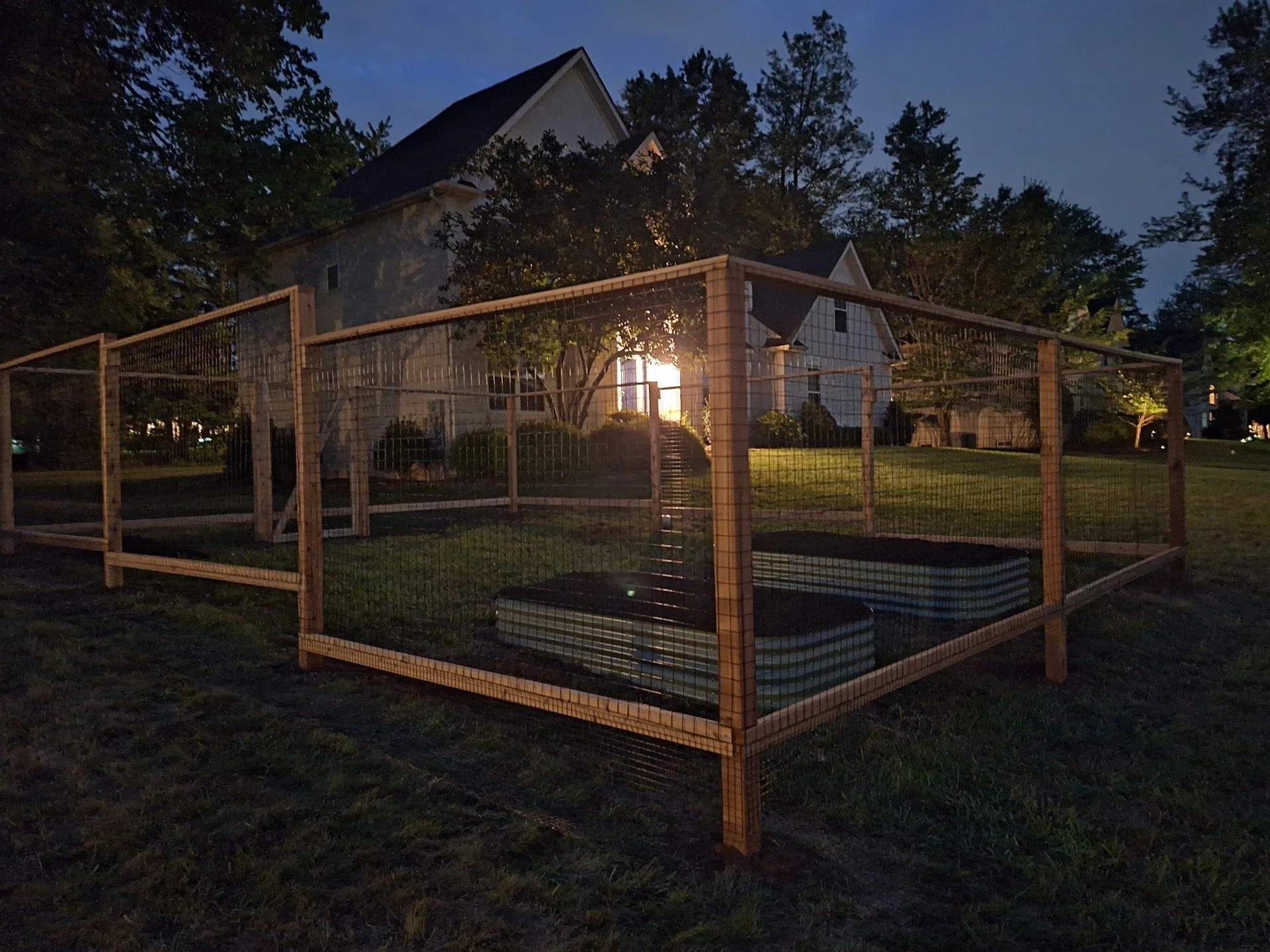 We finished up this vegetable garden last night! The posts &amp; rails are rot-resistant cedar, the fencing material is a PVC-coated welded wire. Two @vego_garden raised beds sit inside the garden, filled with a garden soil blend, ready to be planted