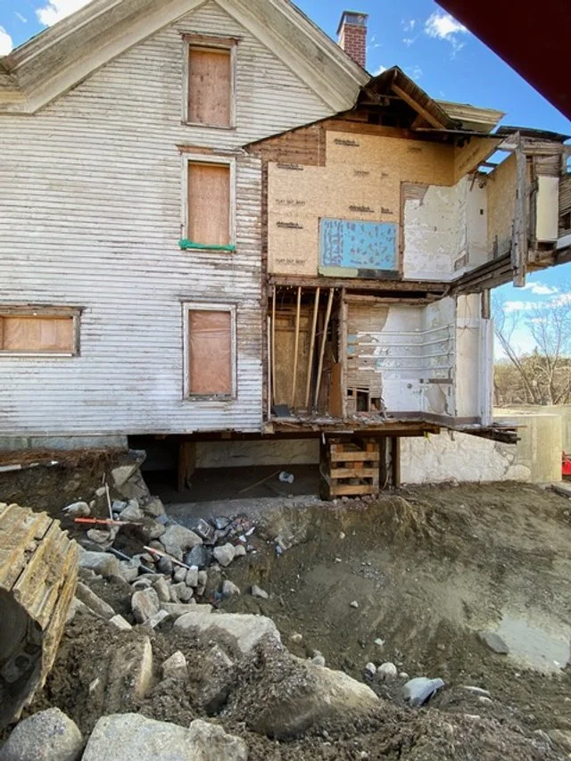 summer 2024 NW corner - house raised on steel beam.jpeg