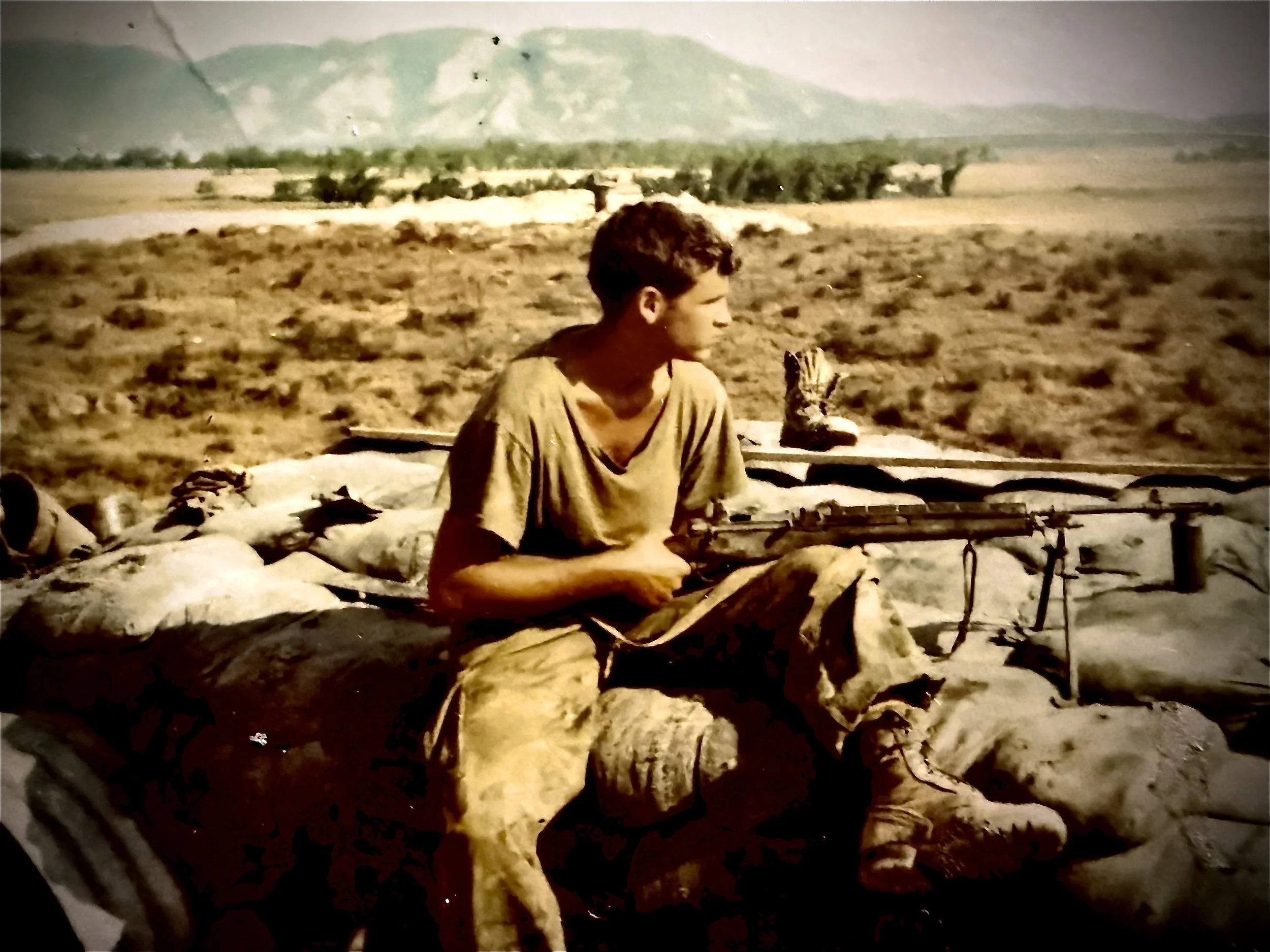Sitting on a bunker on Hill 190, 17 miles NW of Da Nang, Vietnam. 1970.