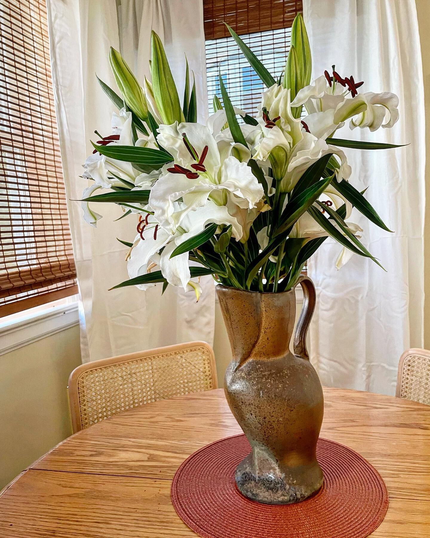 Fresh and fragrant lilies in a wood fired pitcher that was right behind the side stoke in Alfred train kiln  #woodfired #cone10 #ceramics #alfredtrainkiln #trainkiln