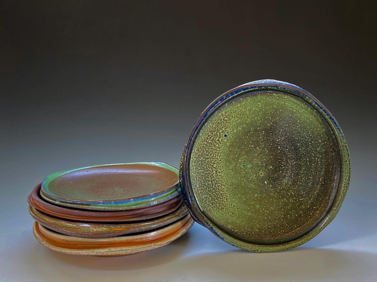 Soda fired porcelain plates with colored flashing slips that I have been developing.  #sodafired #ceramics #porcelain #flashingslip