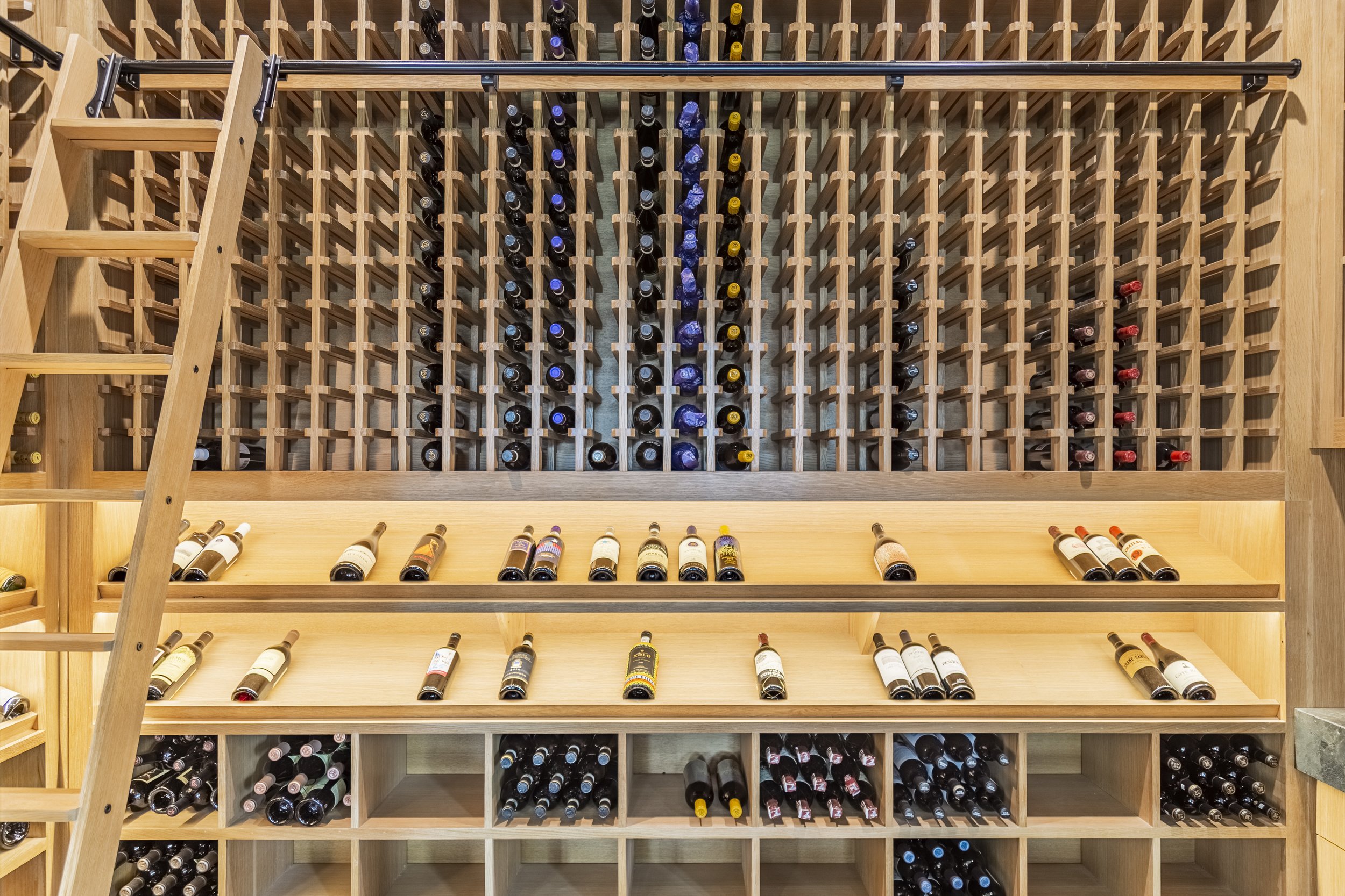 Rift Cut White Oak Custom Wine Room; Sliding Ladder