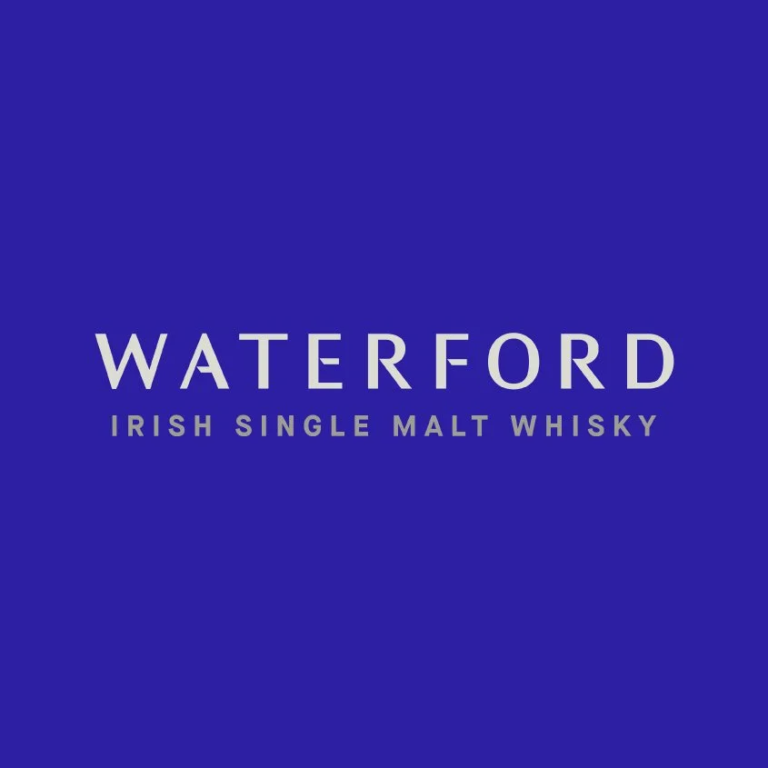 Blue background with the text 'Waterford Irish Single Malt Whisky' in white and purple