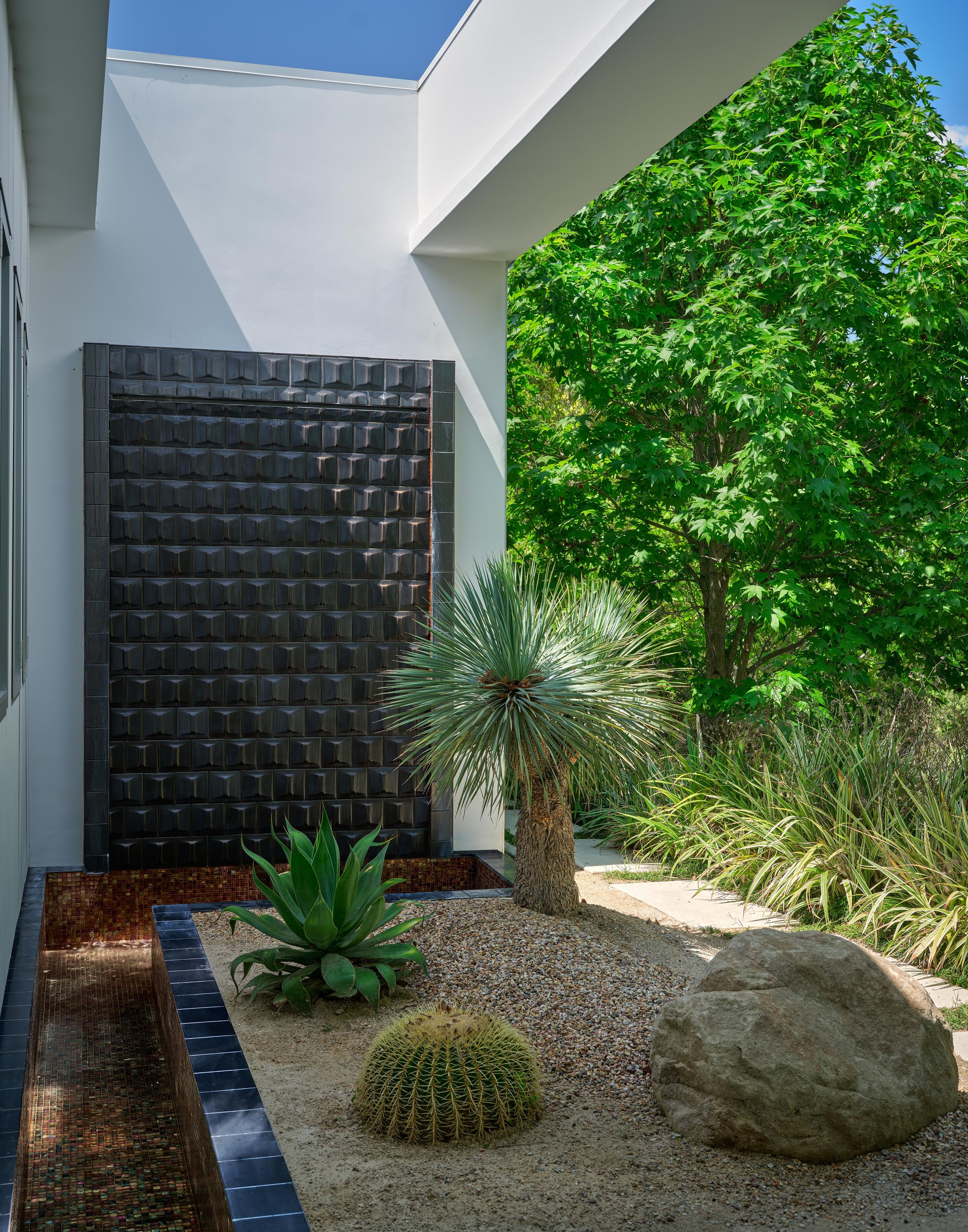 Dry-scape garden of Trousdale Estates area, Beverly Hills luxury home featuring rock and cactus garden with a unique stone wall accent, full-service interior design by Stephen Pappas Interiors, Los Angeles