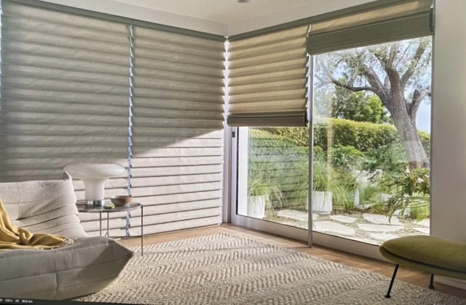 Close-up styling detail for Hunter Douglas showcasing luxury custom window treatments in a living room with curated modern home accessories and furniture, styled by Stephen Pappas Interiors
