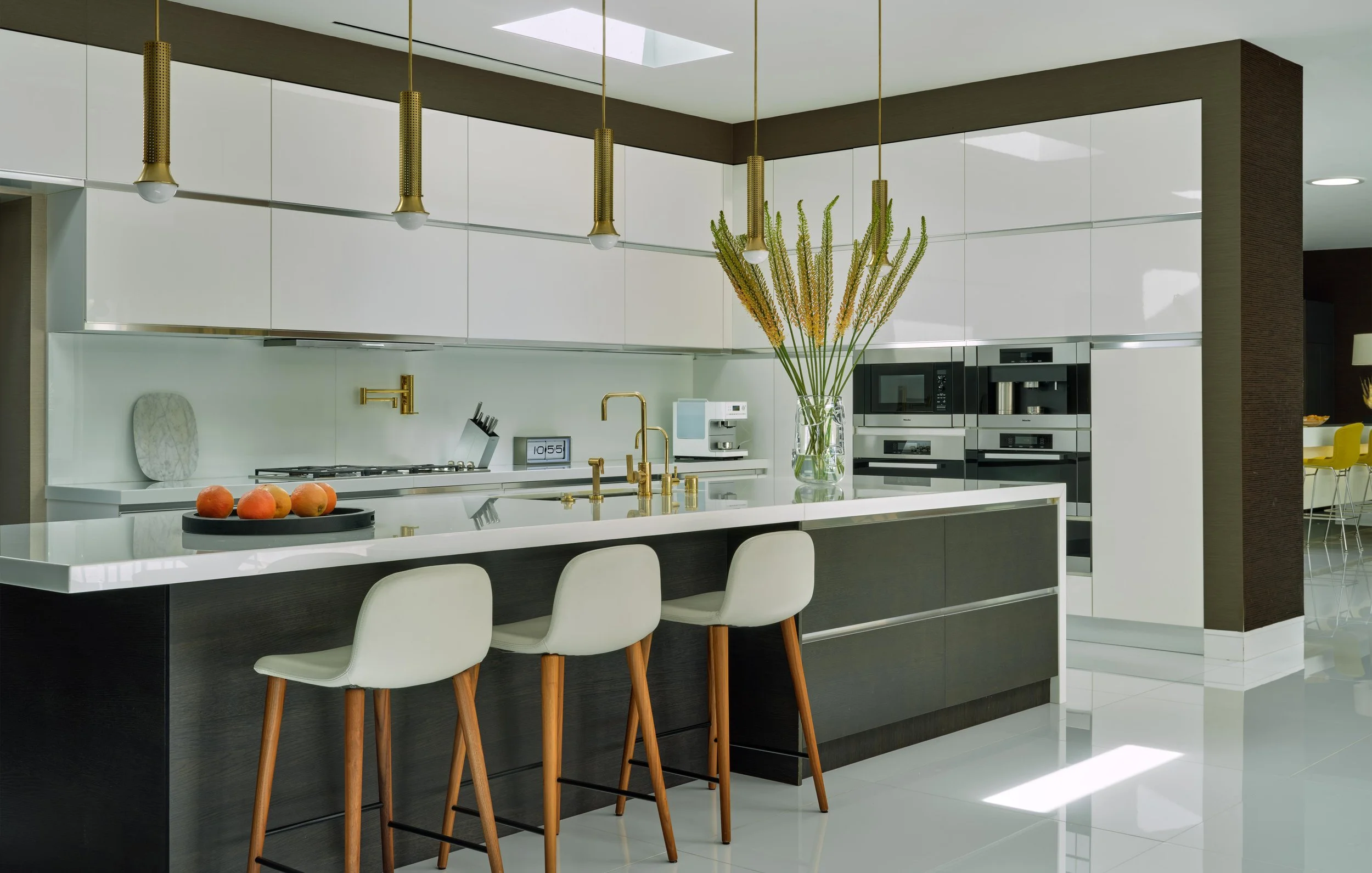 Kitchen of Trousdale Estates area, Beverly Hills luxury home featuring sleek modern cabinets and bar seating, full-service interior design by Stephen Pappas Interiors, Los Angeles