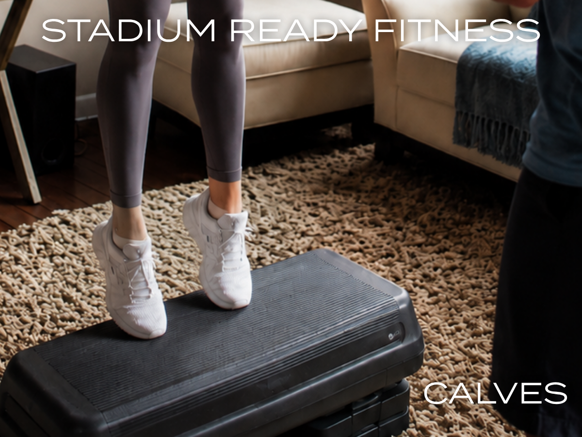 Woman performing calf raises on a step platform during an in-home personal training session for stadium ready fitness.