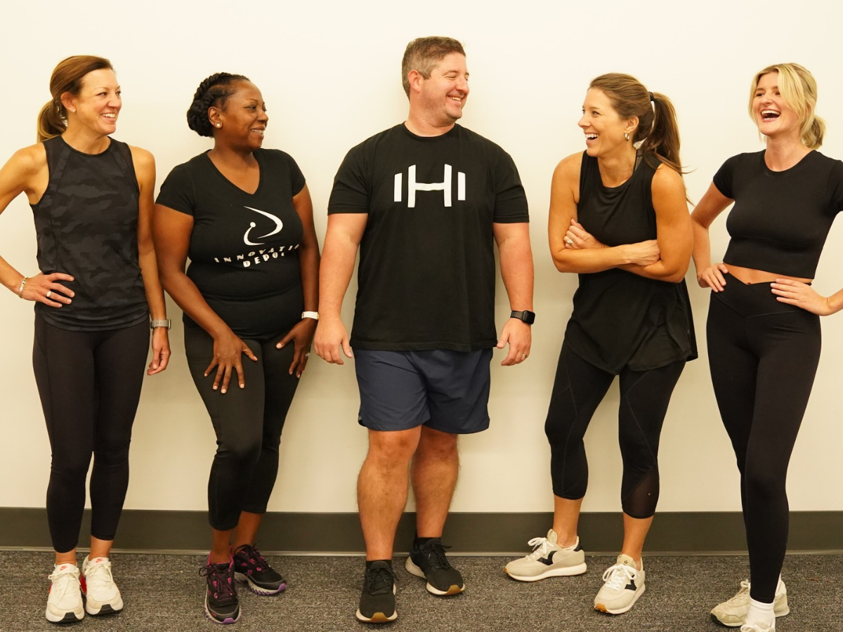 HOMEFIT personal trainer and fitness clients celebrating their progress together, highlighting the benefits of personalized fitness coaching, professional accountability, strength training, and supportive in-home personal training programs.