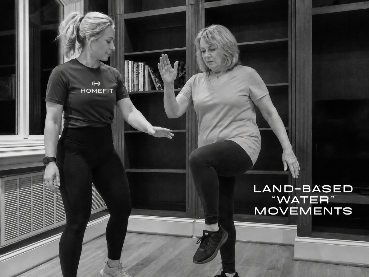 HOMEFIT trainer guides an older client through a slow standing knee lift inspired by low-impact water aerobics.