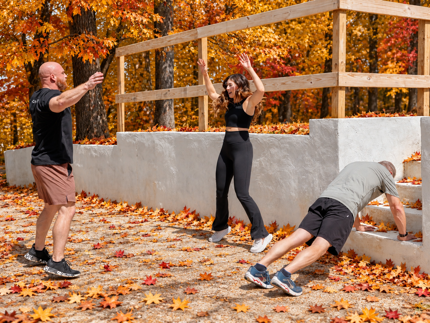 1. HOMEFIT fall fitness training session with a personal trainer guiding clients through functional exercises and seasonal outdoor workouts.