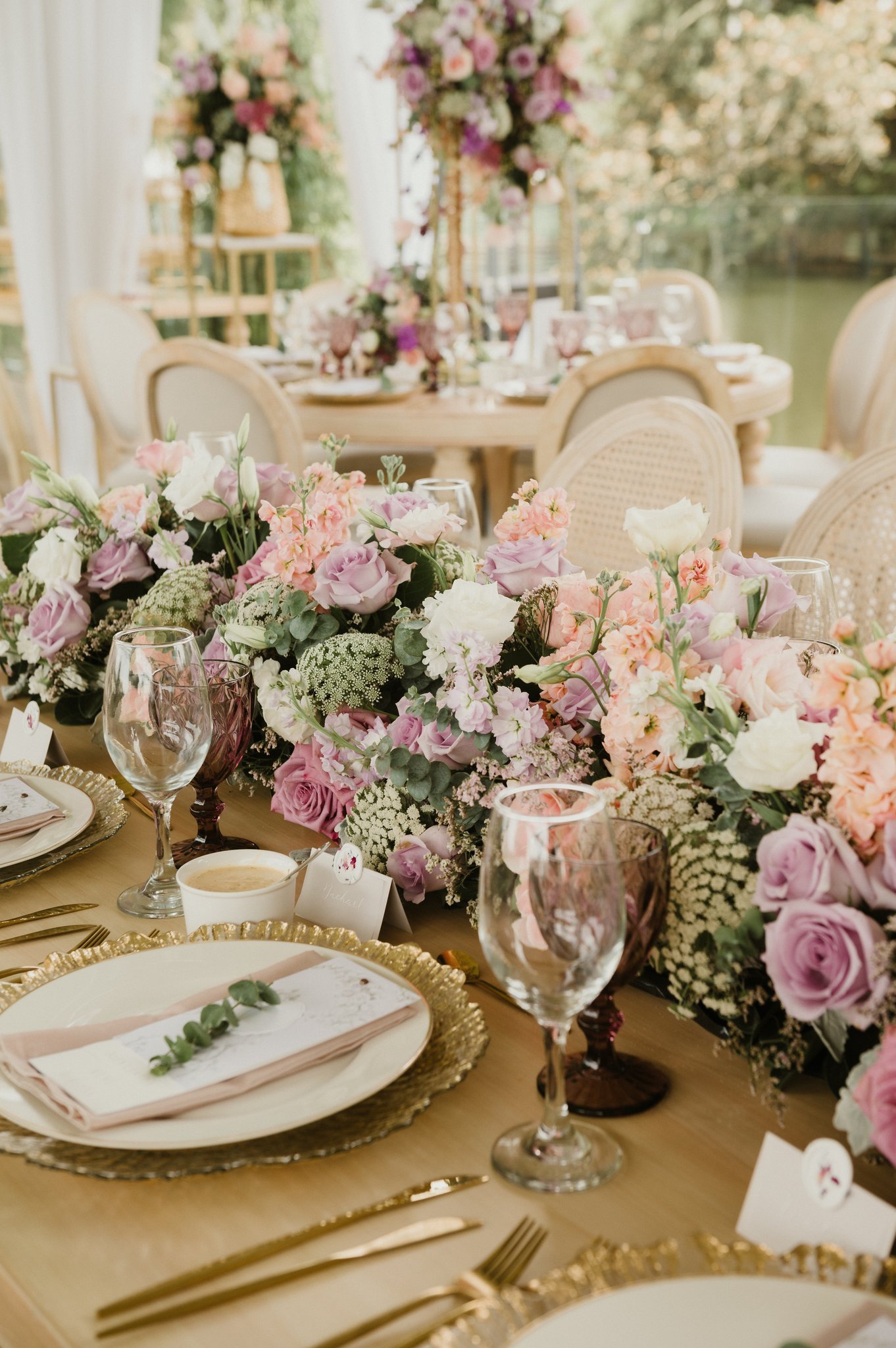 Wedding tablescape with custom menus and florals in purple tones