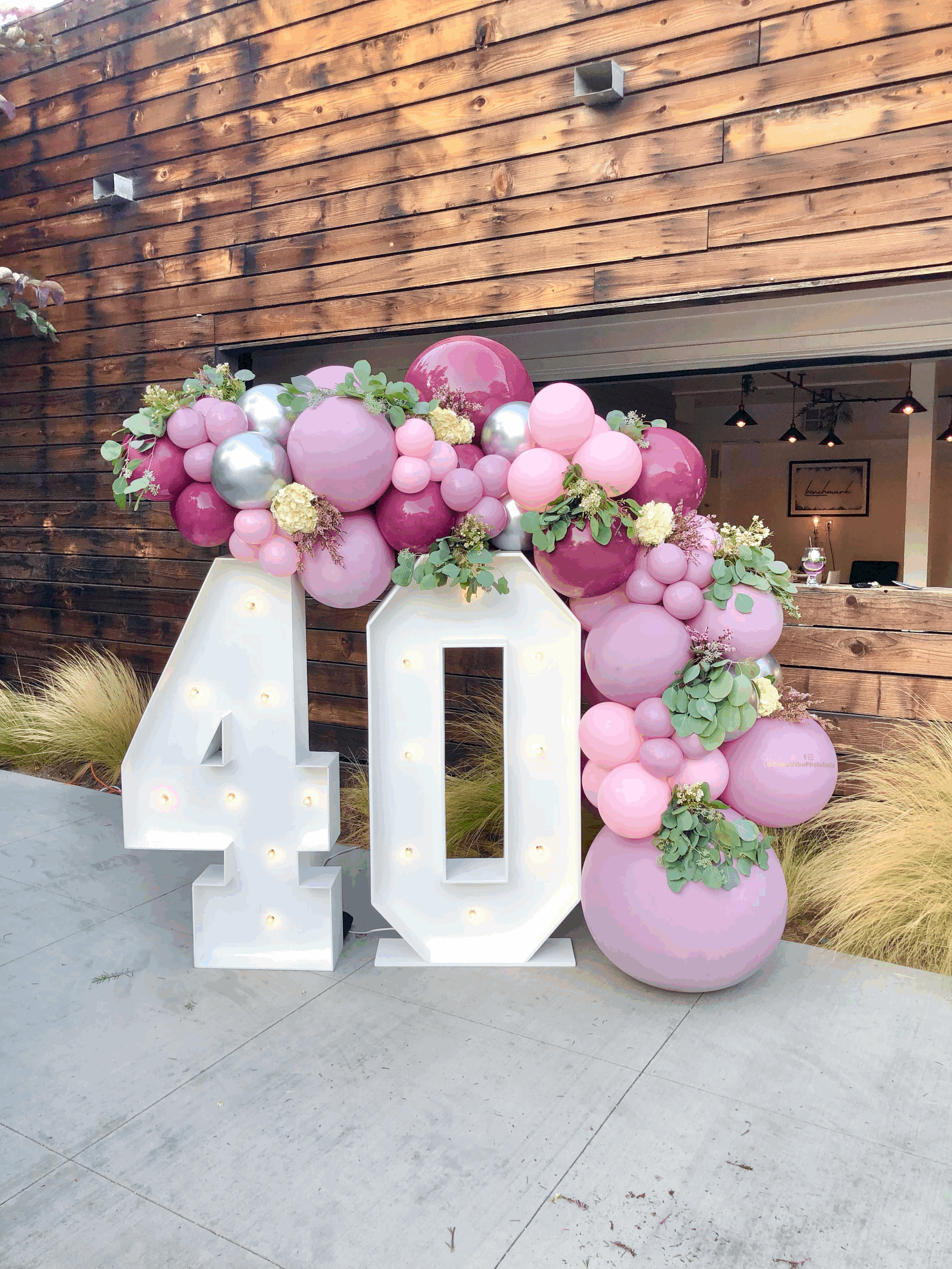 Light up Numbers with balloons decorations for 40th birthday.