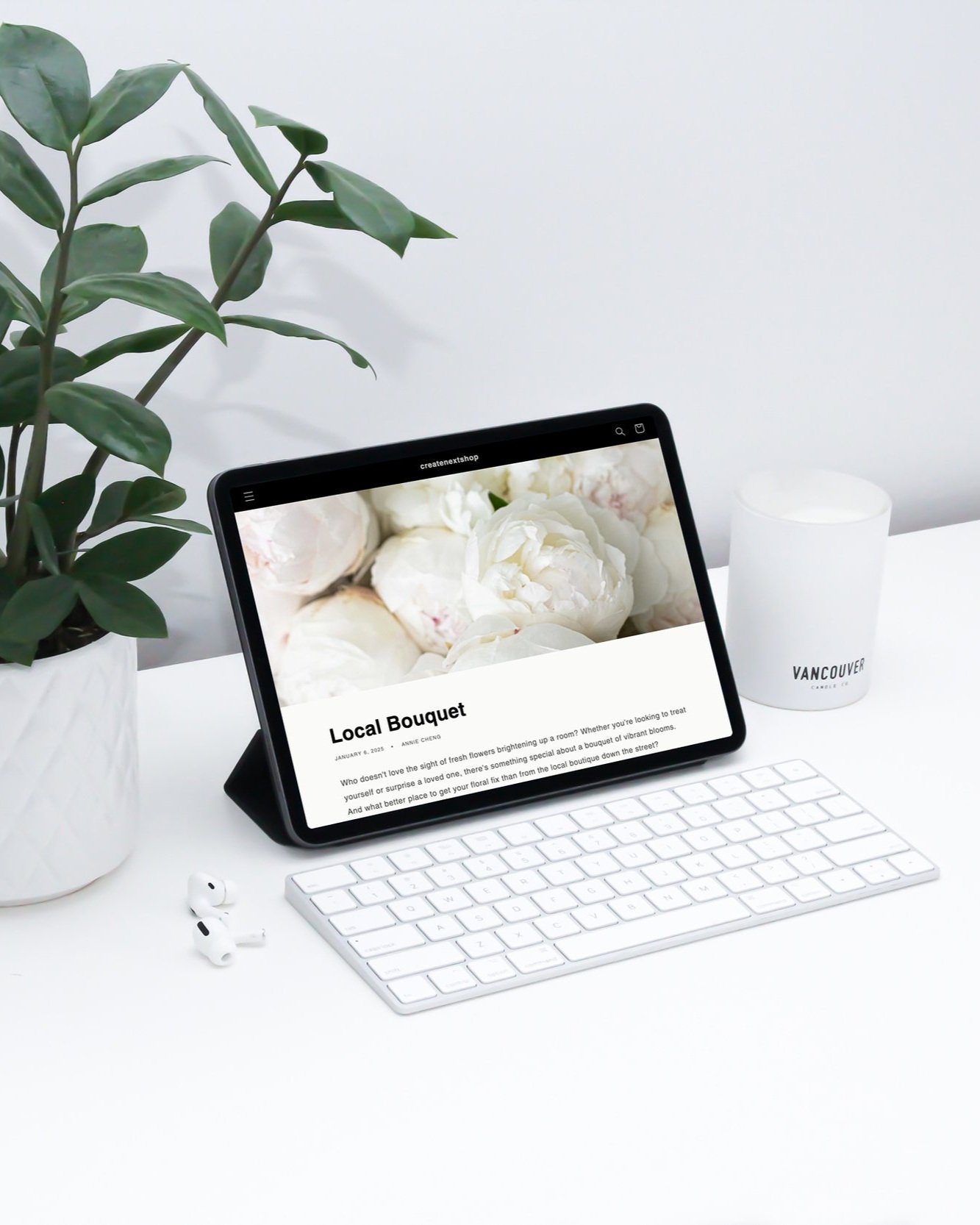 mockuuups-ipad-mockup-on-a-white-table-beside-airpods-pro.jpg