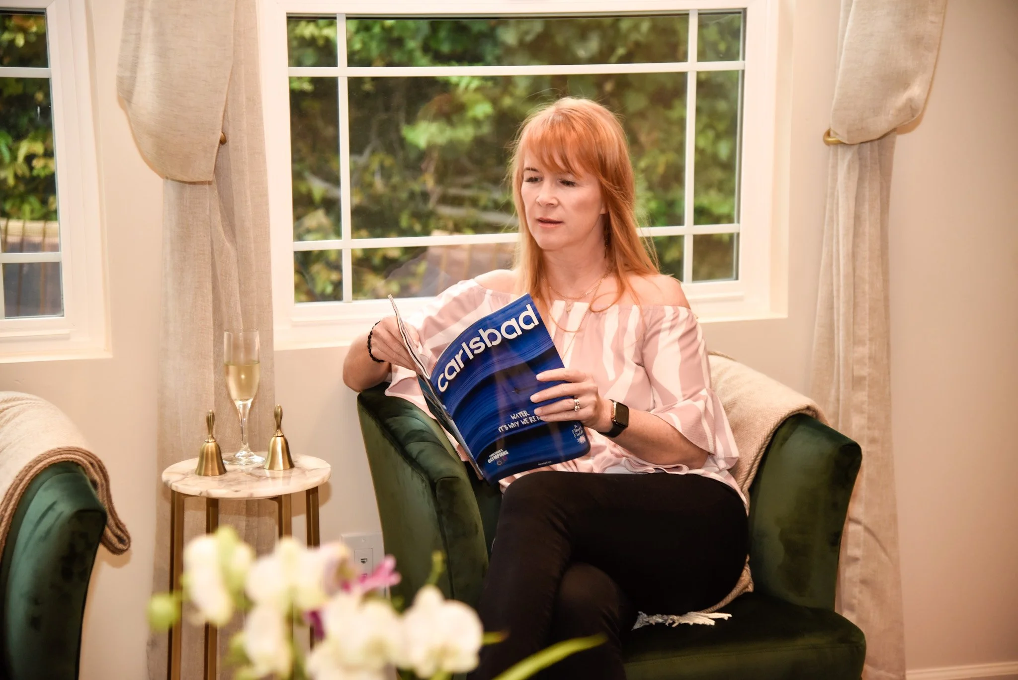 Woman reading at med spa carlsbad