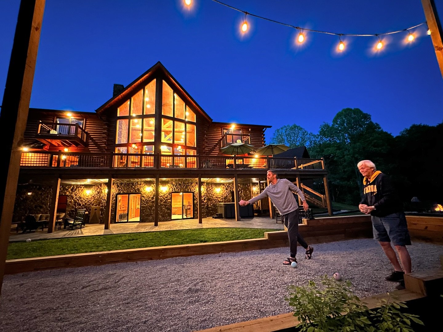 A friendly little game of bocce ball under the string lights - just one of the endless things to do at Golden Acres Lodge🤩