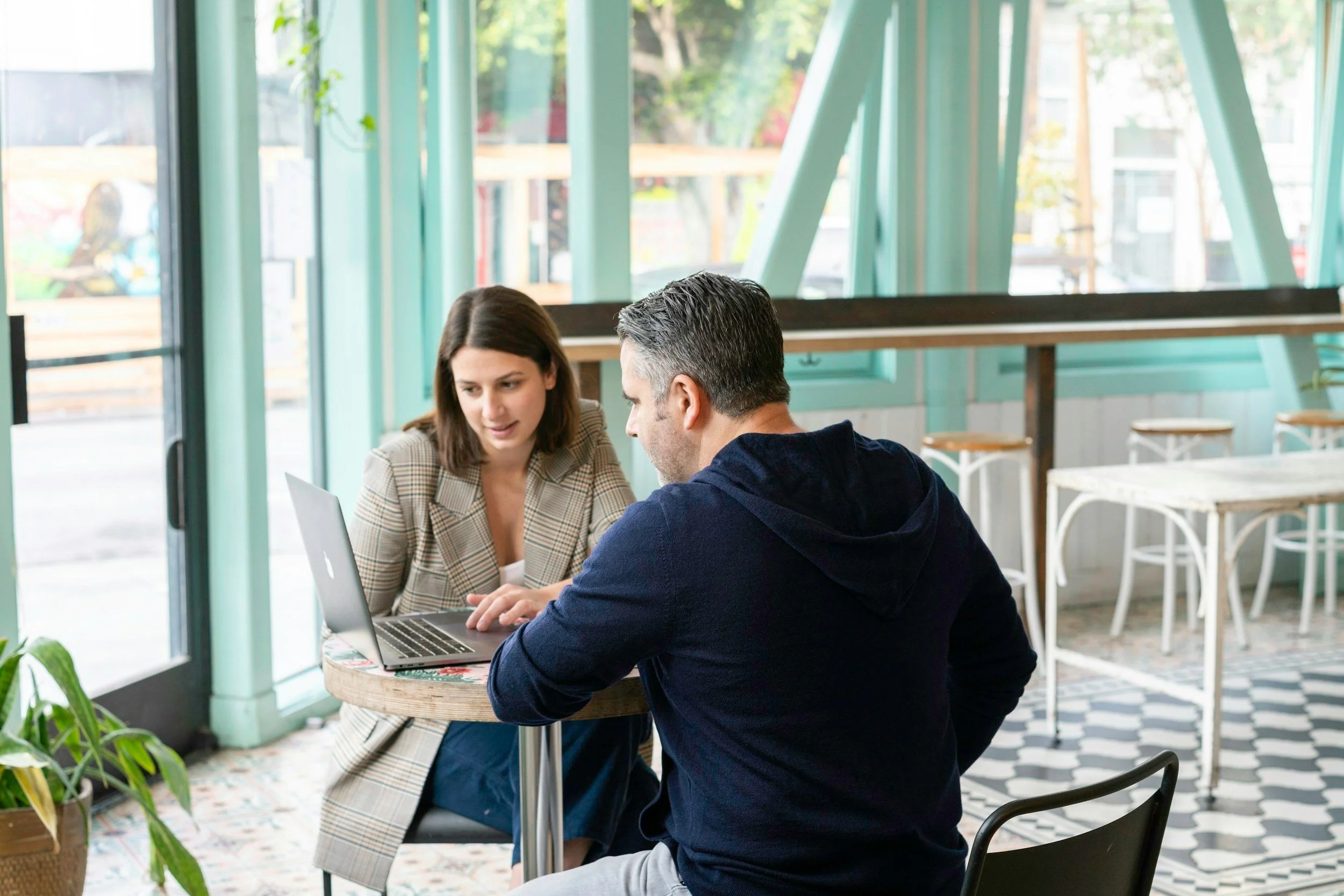 Man and woman working on computer