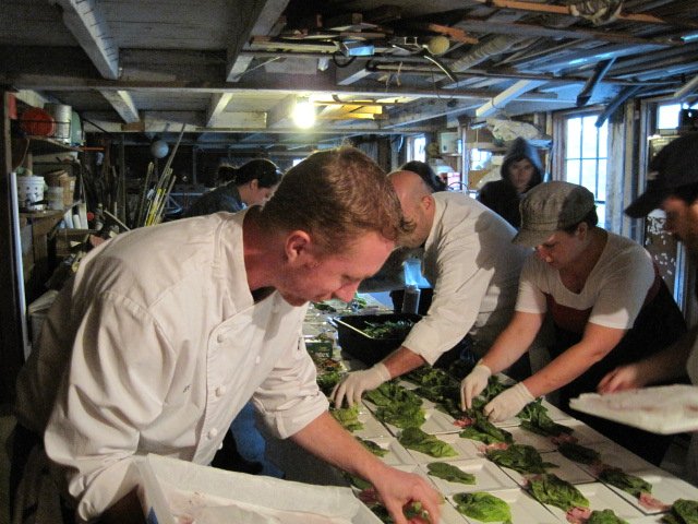 chefs working in a barn