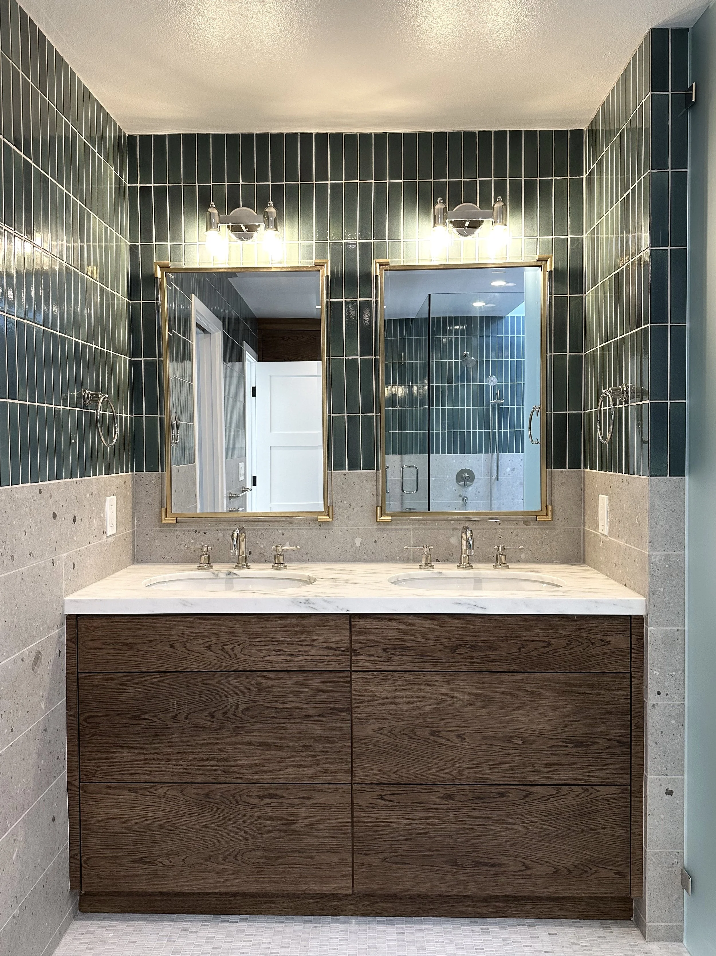 Huntington beach bathroom remodel. Wood vanity, marble accents and teal tile.
