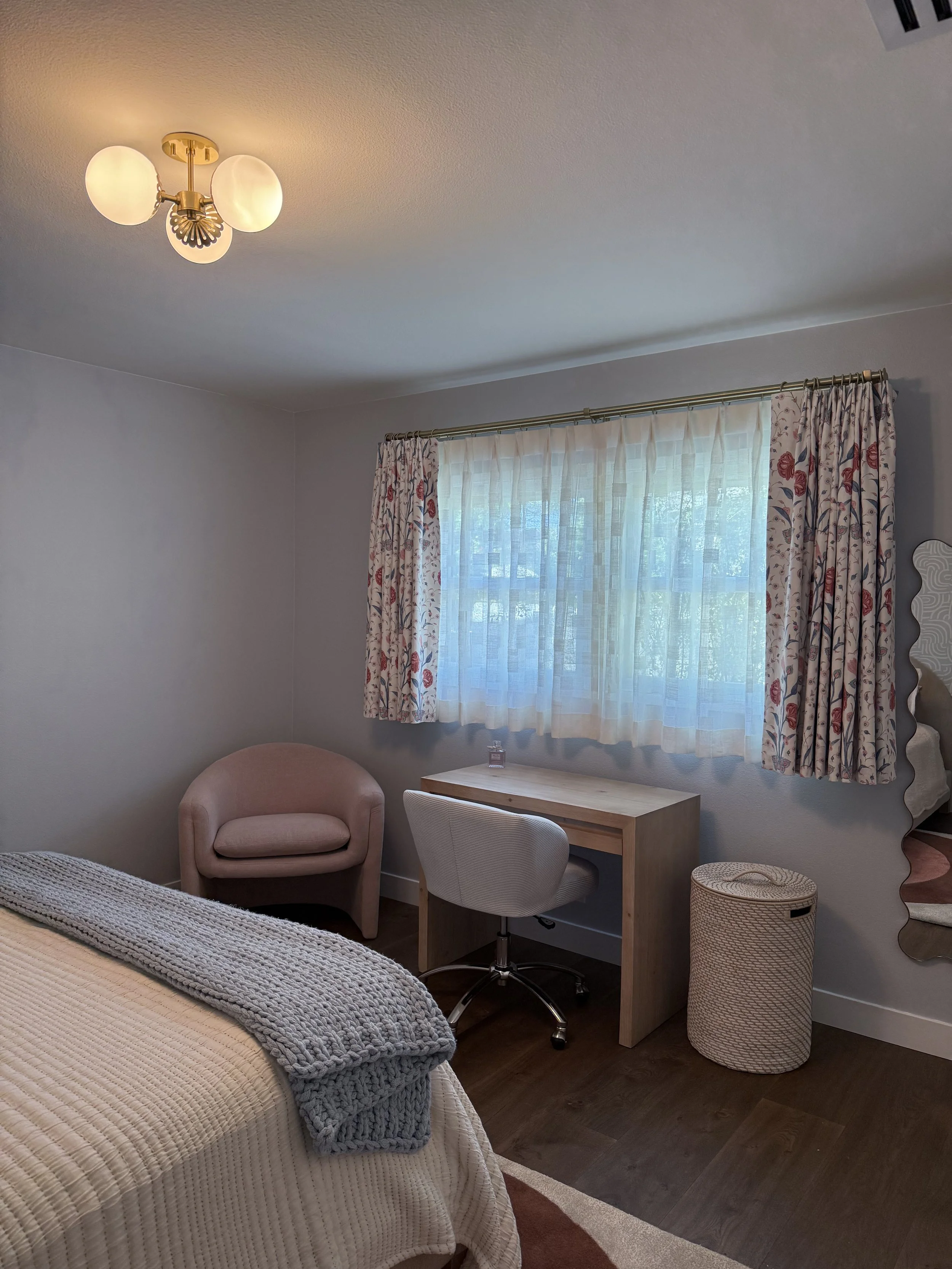 Children's bedroom with custom drapery and reading nook.