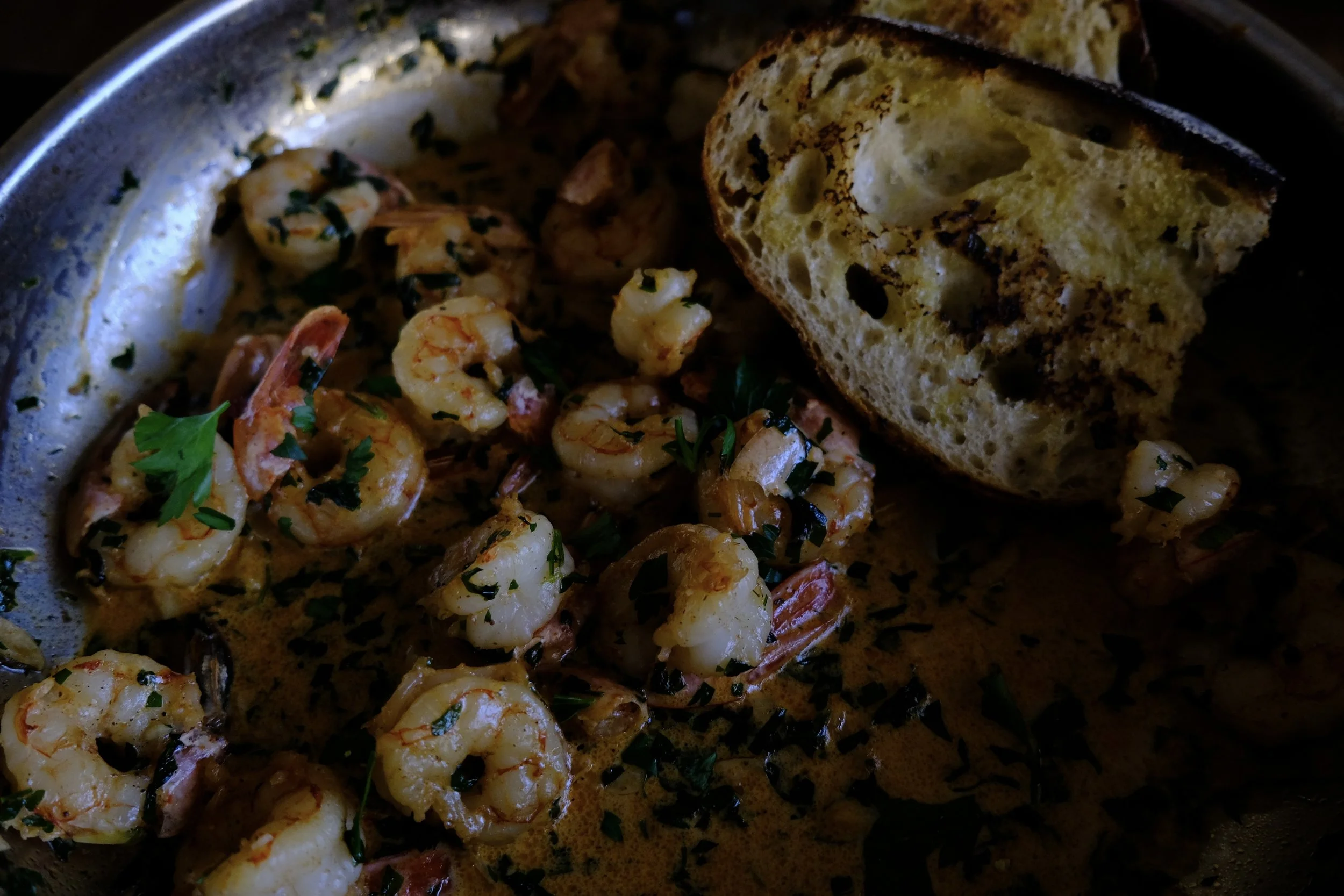 Shrimp in garlic and white wine served with grilled sourdough