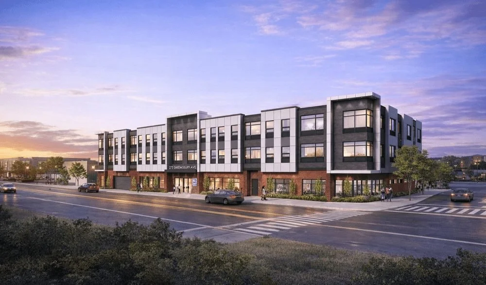A mixed-use residential and retail building exterior, a fire protection project by More Group Fire Protection
