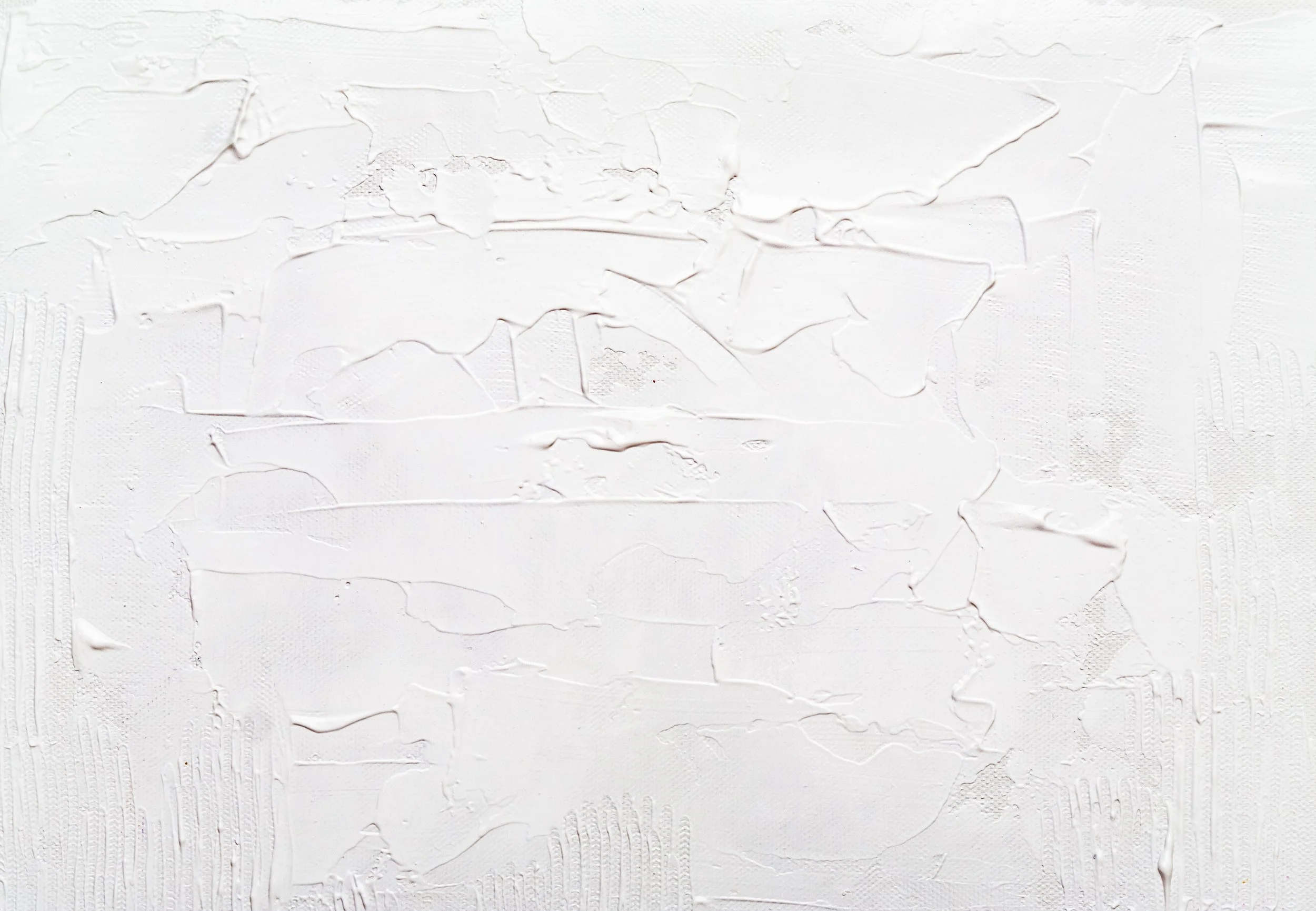 A close-up image of a textured white surface with thick, uneven paint strokes.