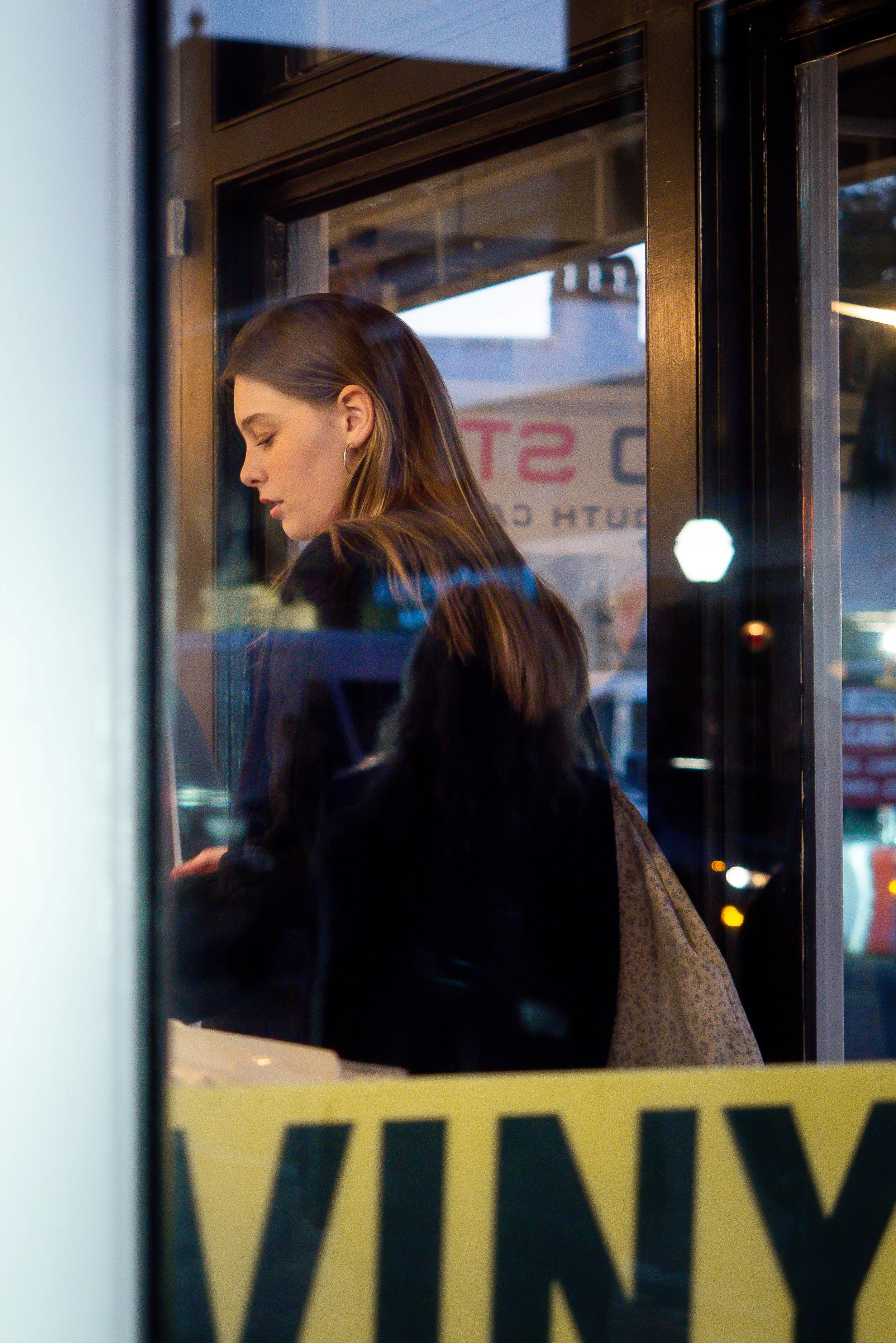 women in vinyl record shop