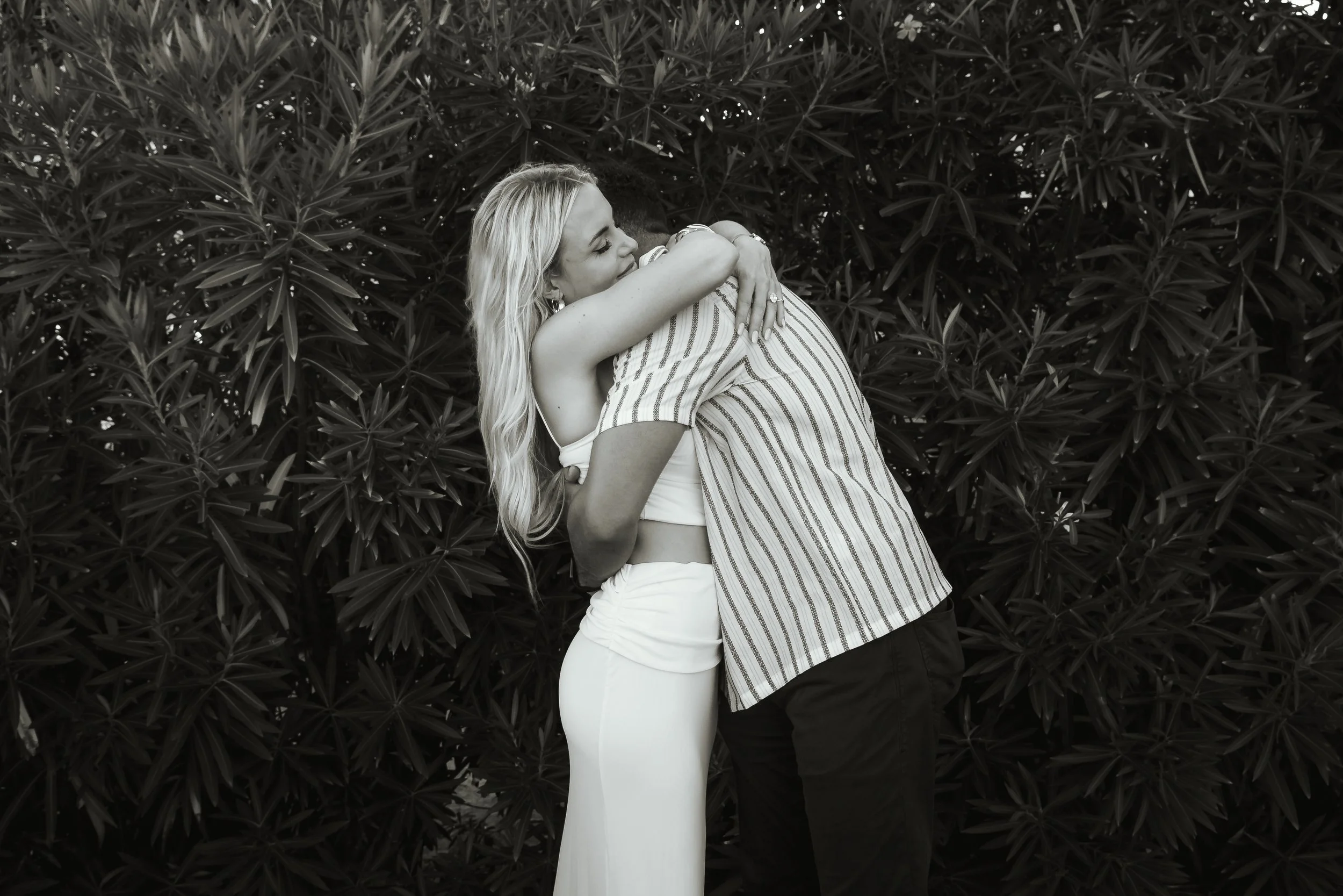 black and white couple hug embrace