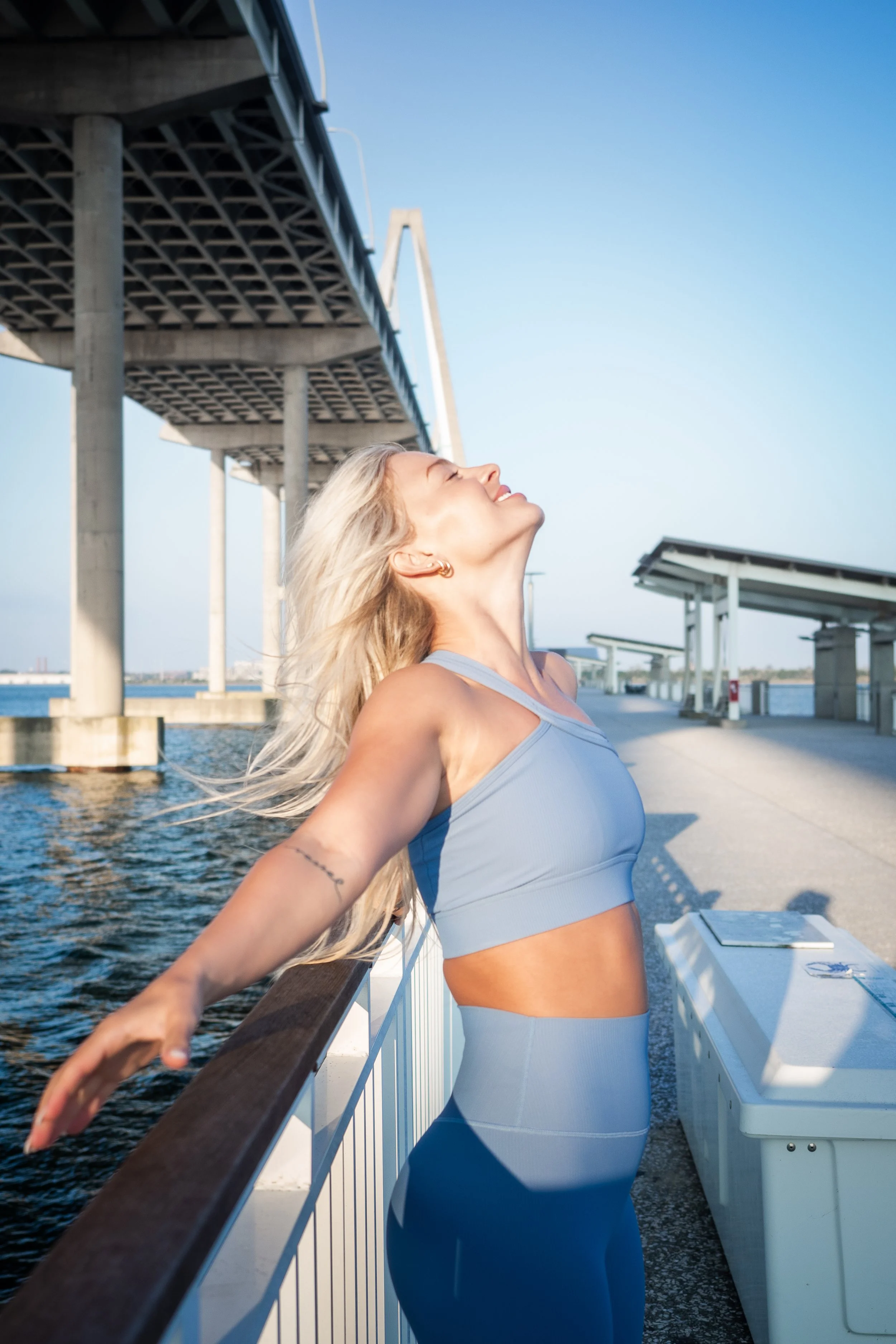 fitness women on bridge photoshoot