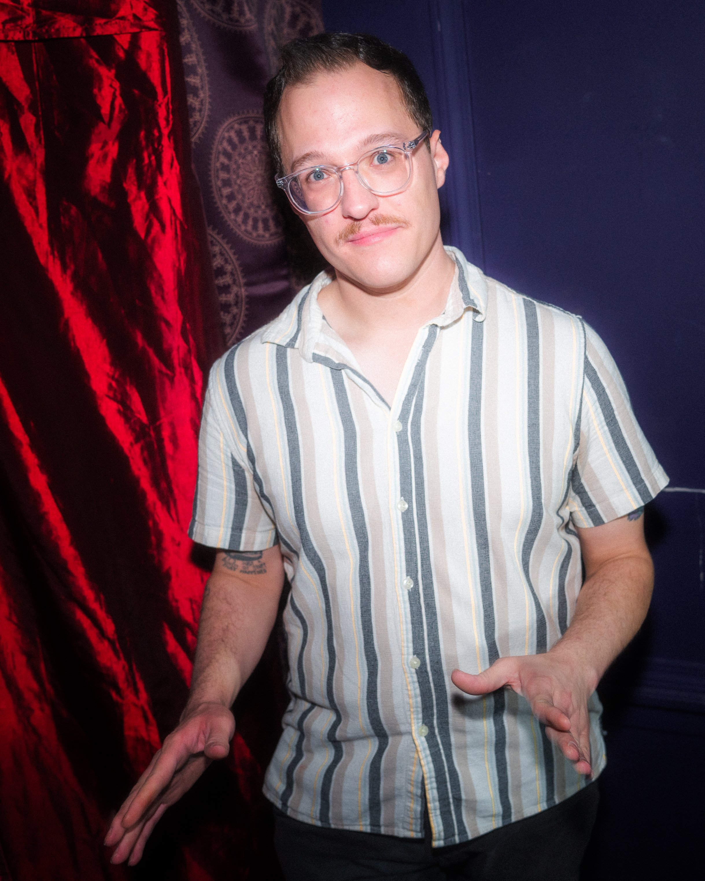 Backstage comedy show portrait.
