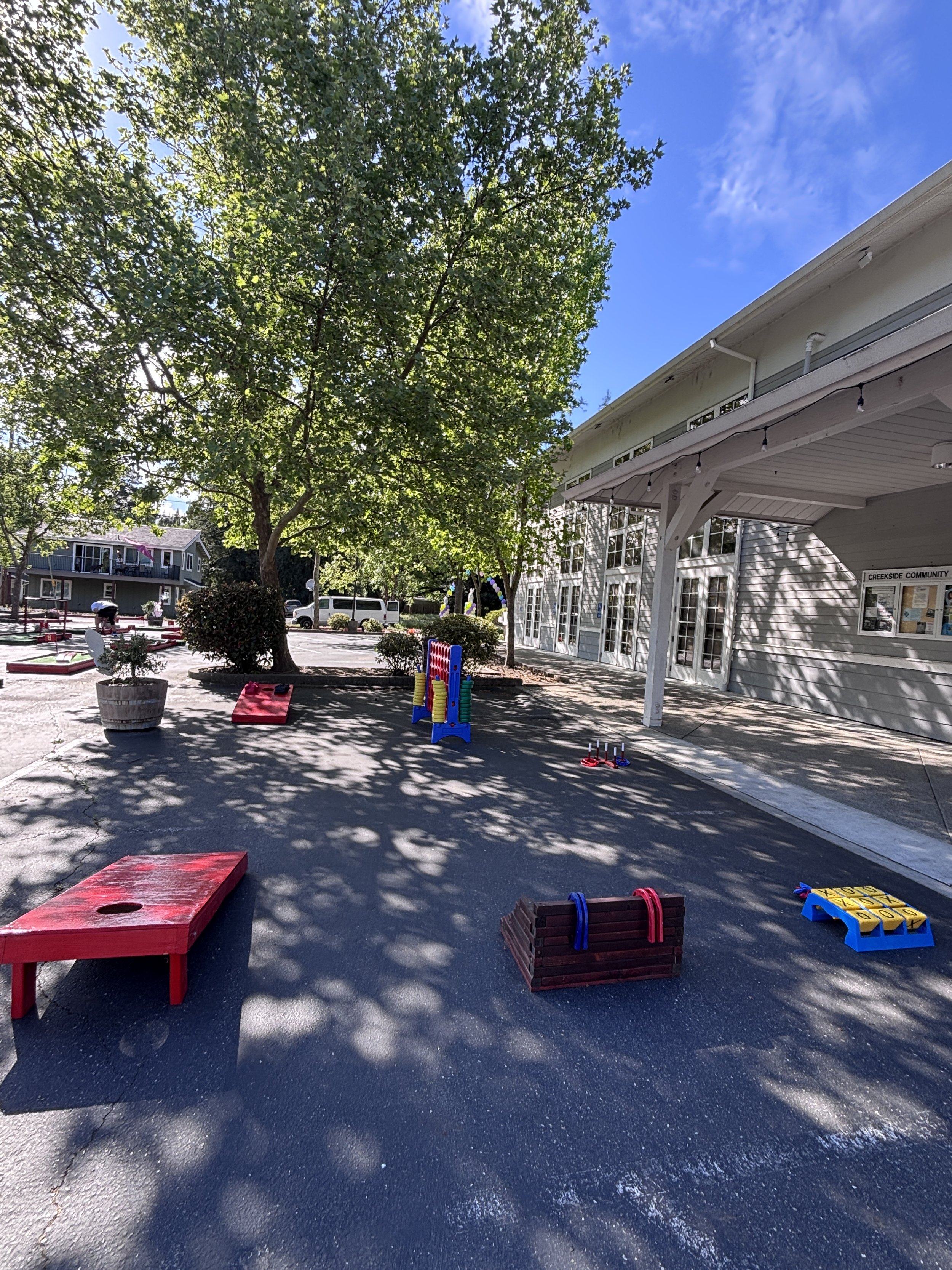 Outdoor plaza with game rental and delivery with cornhole boards, aConnect four game, horseshoes and mini golf