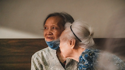 Middle-aged woman caring for elderly woman, reflecting sacrificial love, caregiving responsibility, and identity shaped by showing up in difficult seasons.