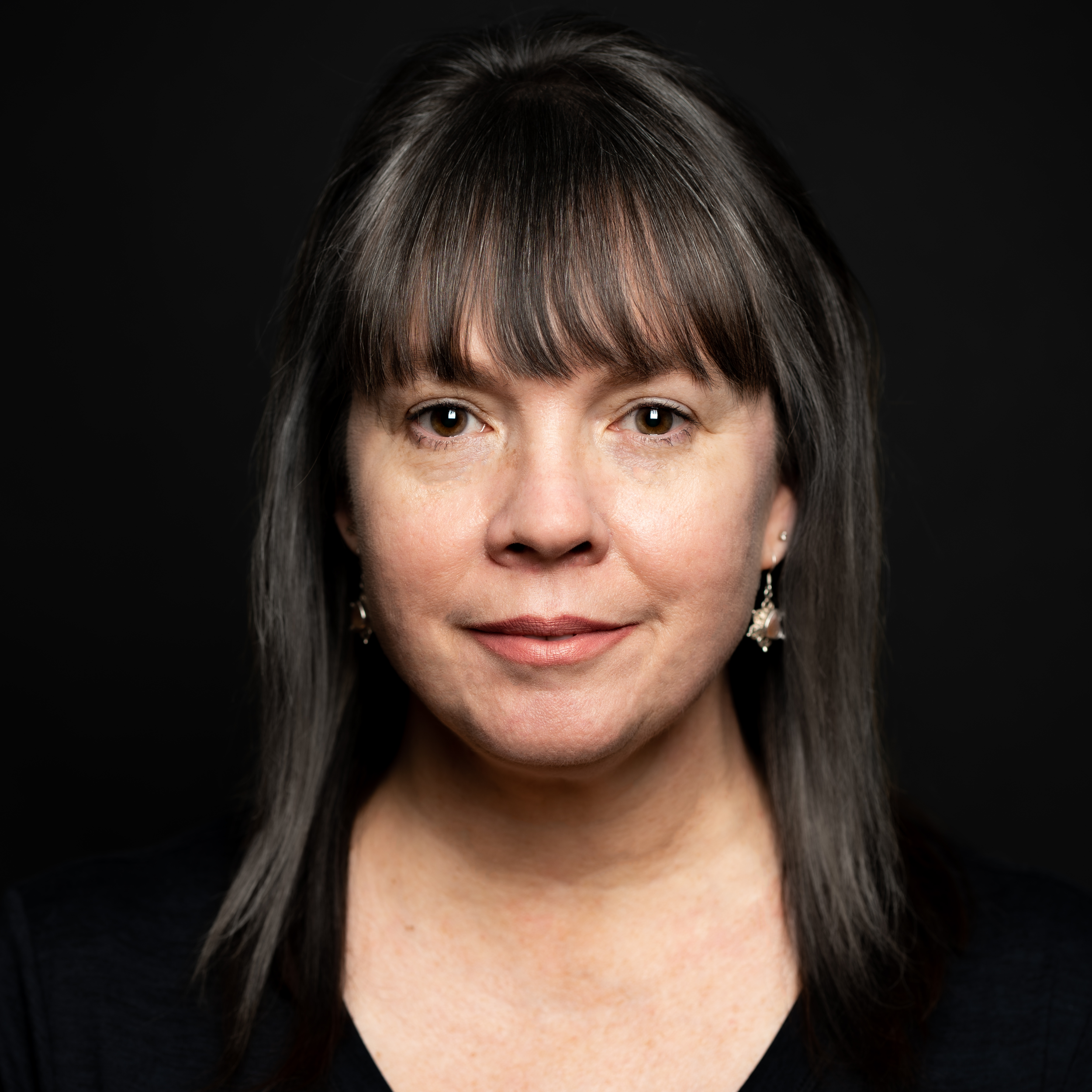 Portrait of Ashley Wong, intuitive psychic medium and founder of Made by a Real Witch, in a calm and natural setting