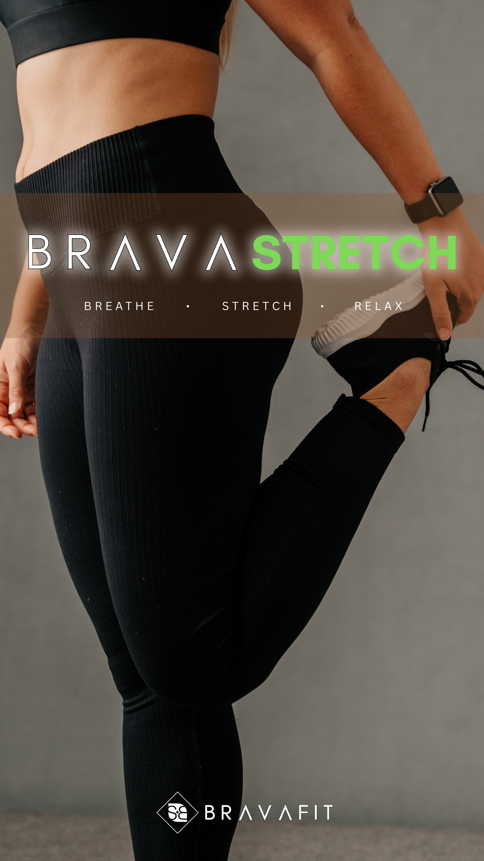 woman in black outfit holding her foot to stretch her quads