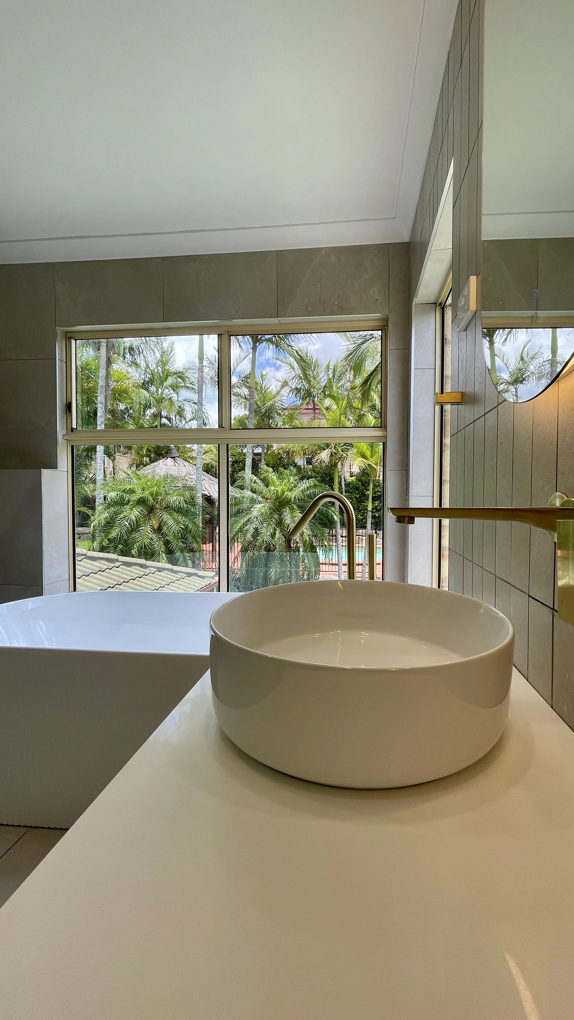 Shailer Park, Logan area, Southside of Brisbane bathroom renovation. Beautiful modern bathroom, white basin, timber ribbed vanity, white ribbed bath tub. 