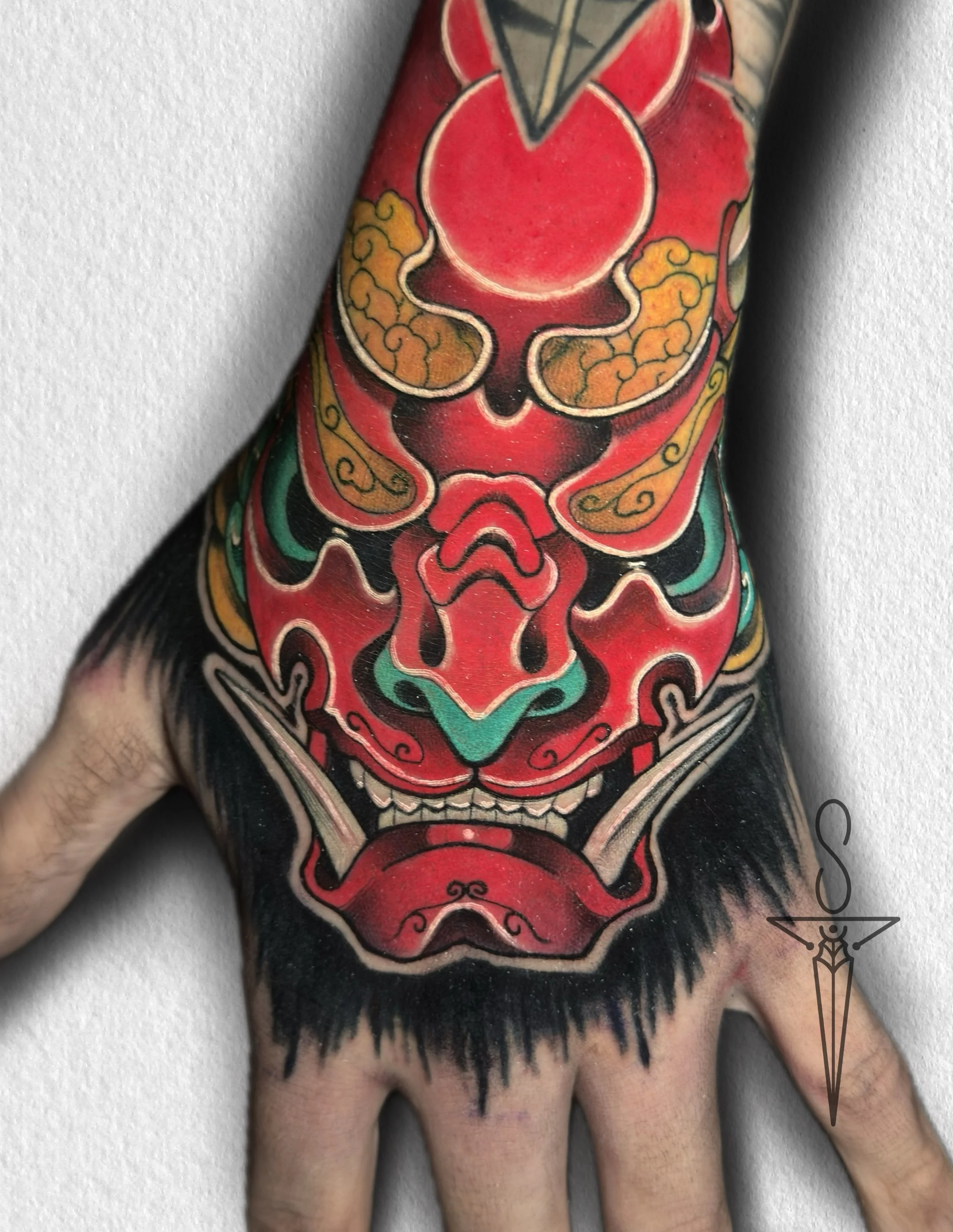 mask-hand-tattoo-rockford-il