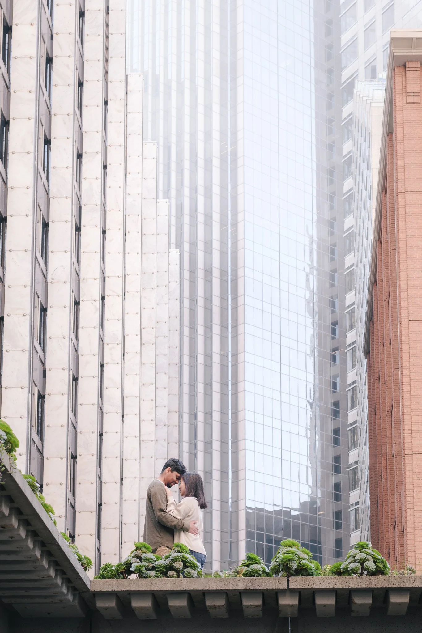 Couple walking at the Embarcadero during engagement session, San Francisco