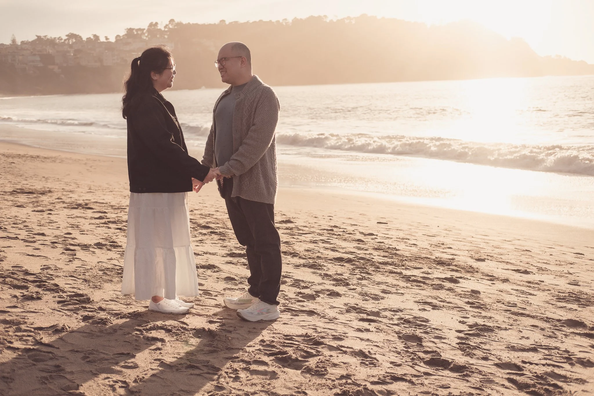 Couple at Baker Beach with Golden Gate Bridge, SF engagement photography