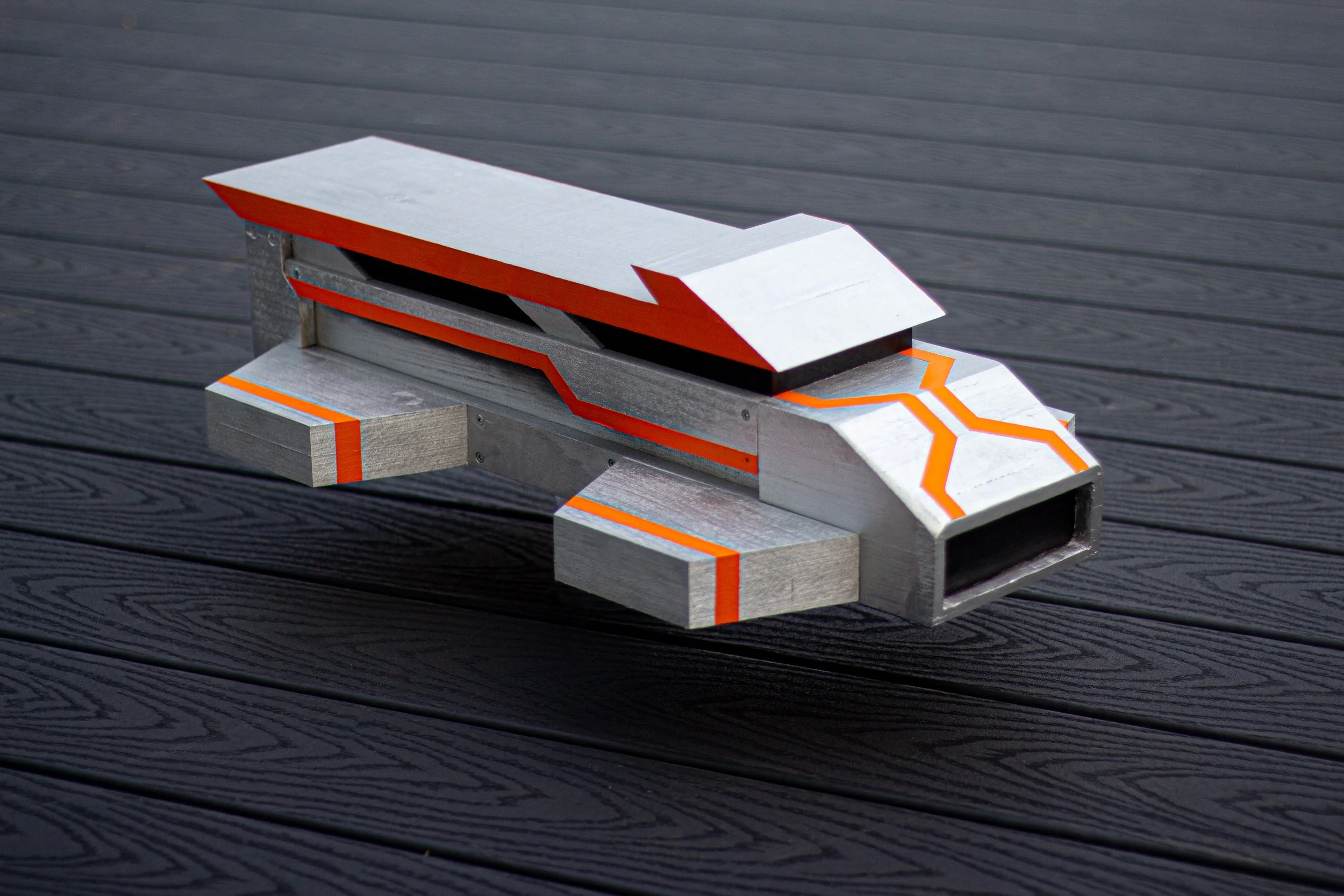 “JPNY II” (2023), Wood, acrylic, and spray-paint, 6” x 24” x 12 1/2”.