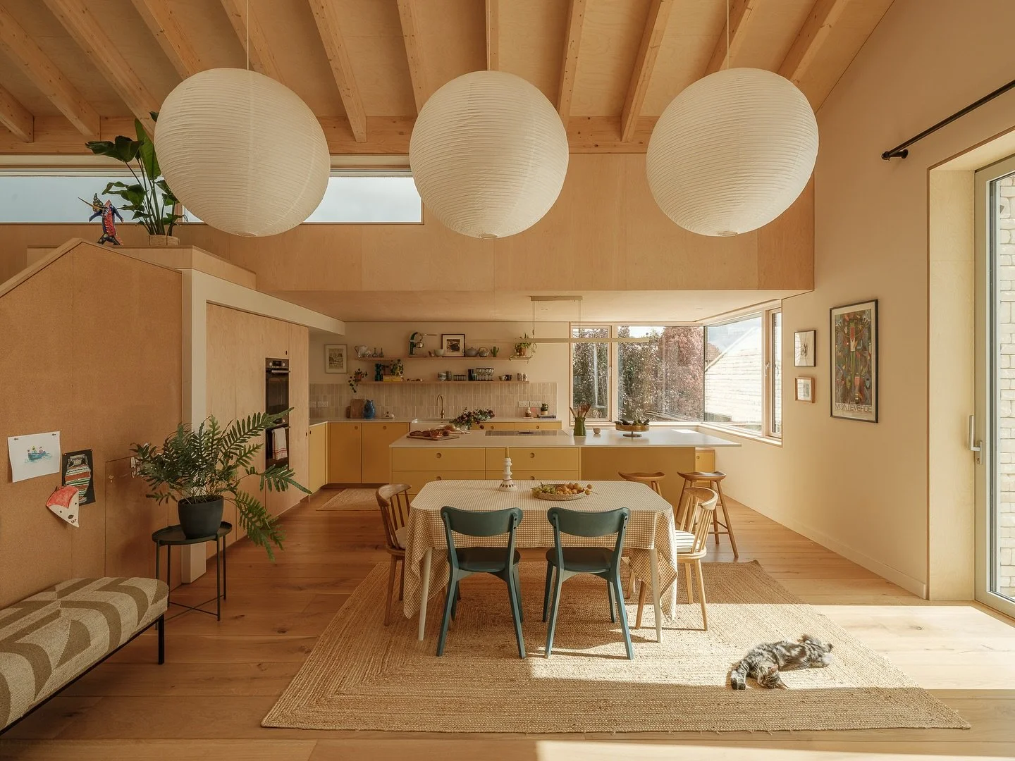 The heart of the home at Sky House

The kitchen and dining space has been beautifully crafted at Sky House. Birch panelling, exposed glulaminated rafters, oak wood flooring and a pale palette of pastel colours creates a warm and welcoming interior fo