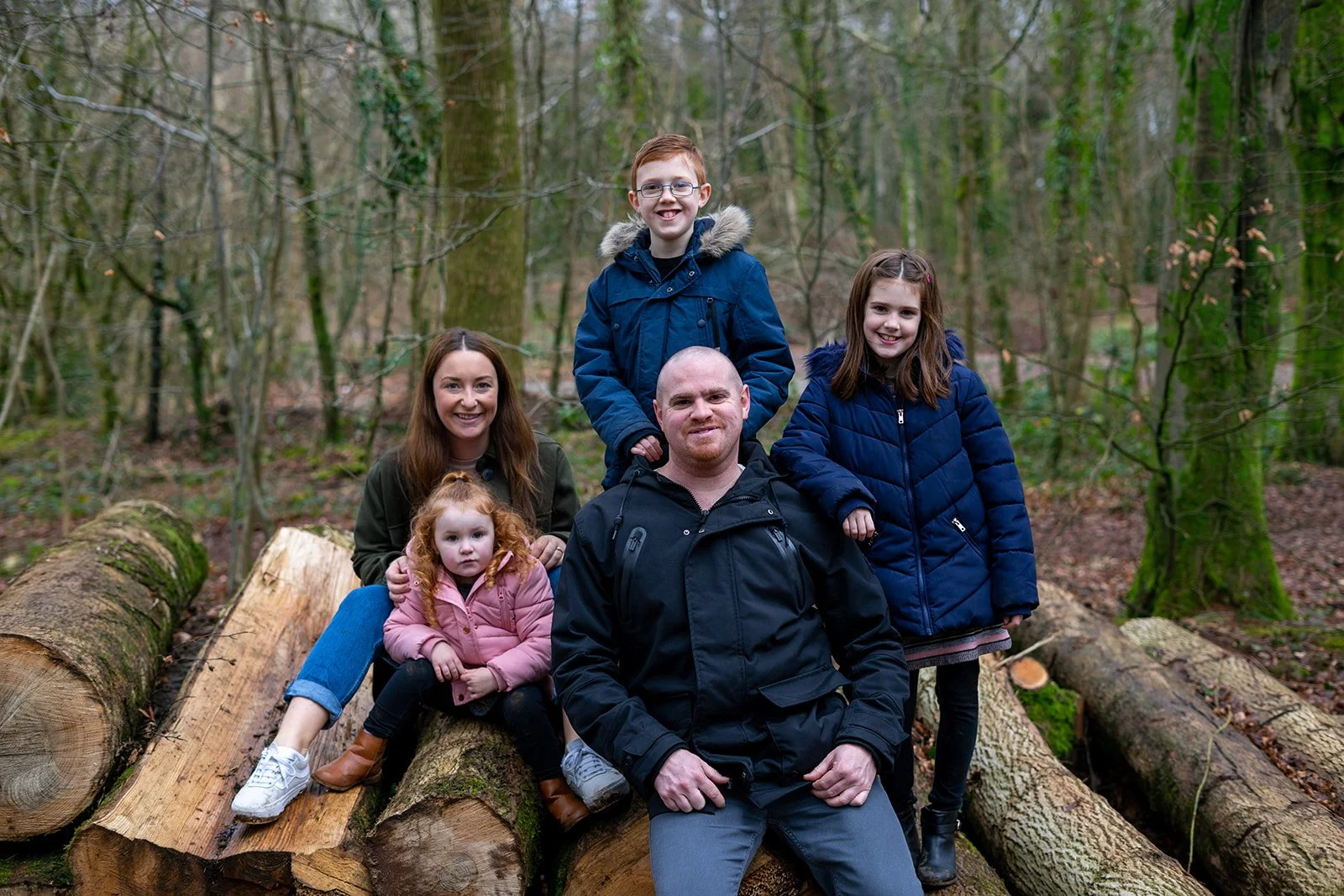 Natural family photoshoot in Cardiff with parents and children smiling