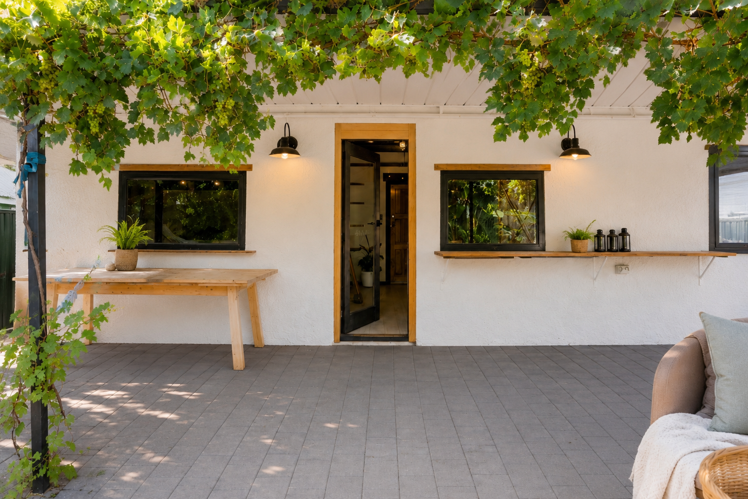 Landscaped courtyard and outdoor living space featuring natural materials and custom construction details