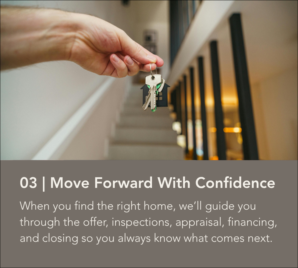 Hand holding keys inside a newly purchased home.